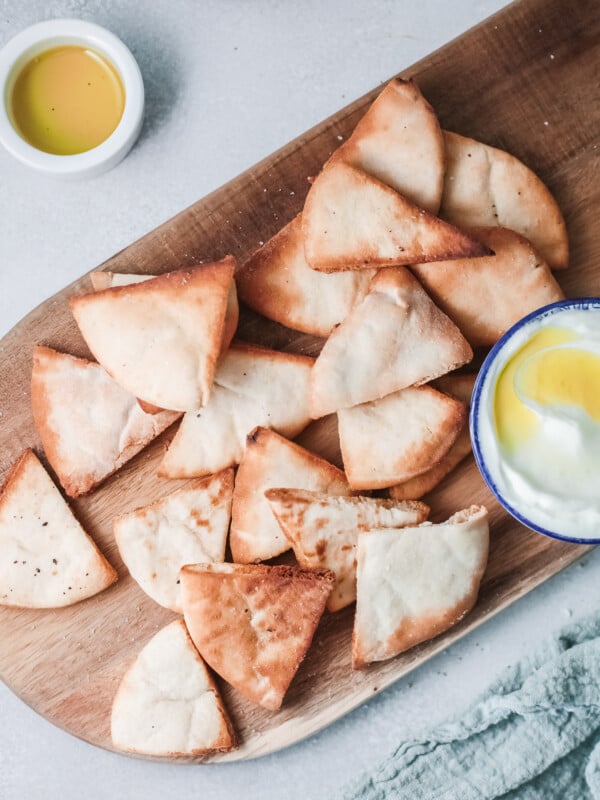 Air Fryer Pita Chips on a wooden board.