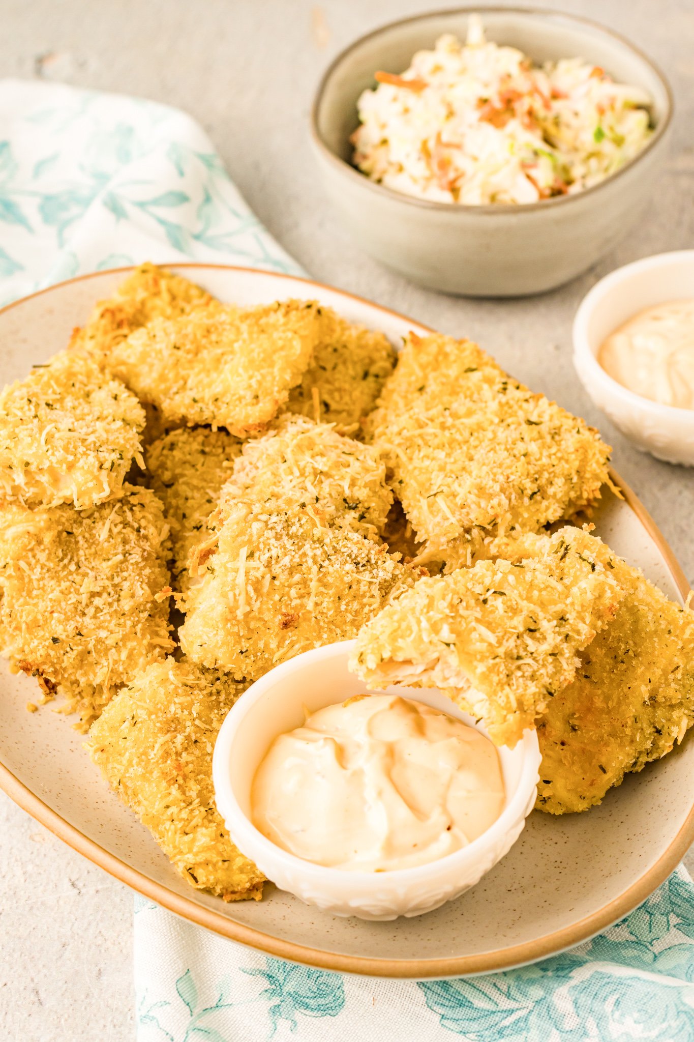 Baked Parmesan Fish Sticks with sauce.