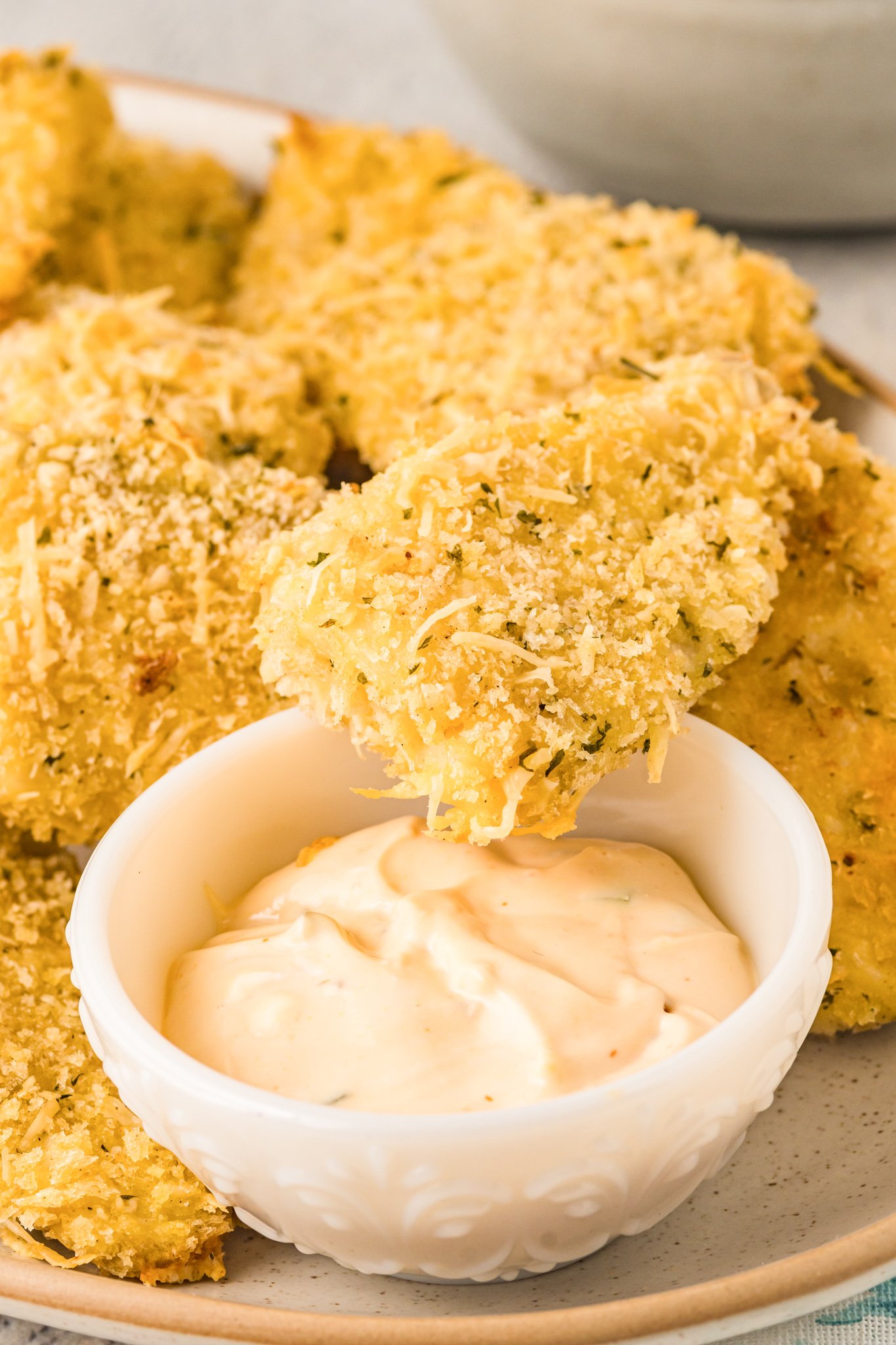 Baked Parmesan Fish Stick in dip.