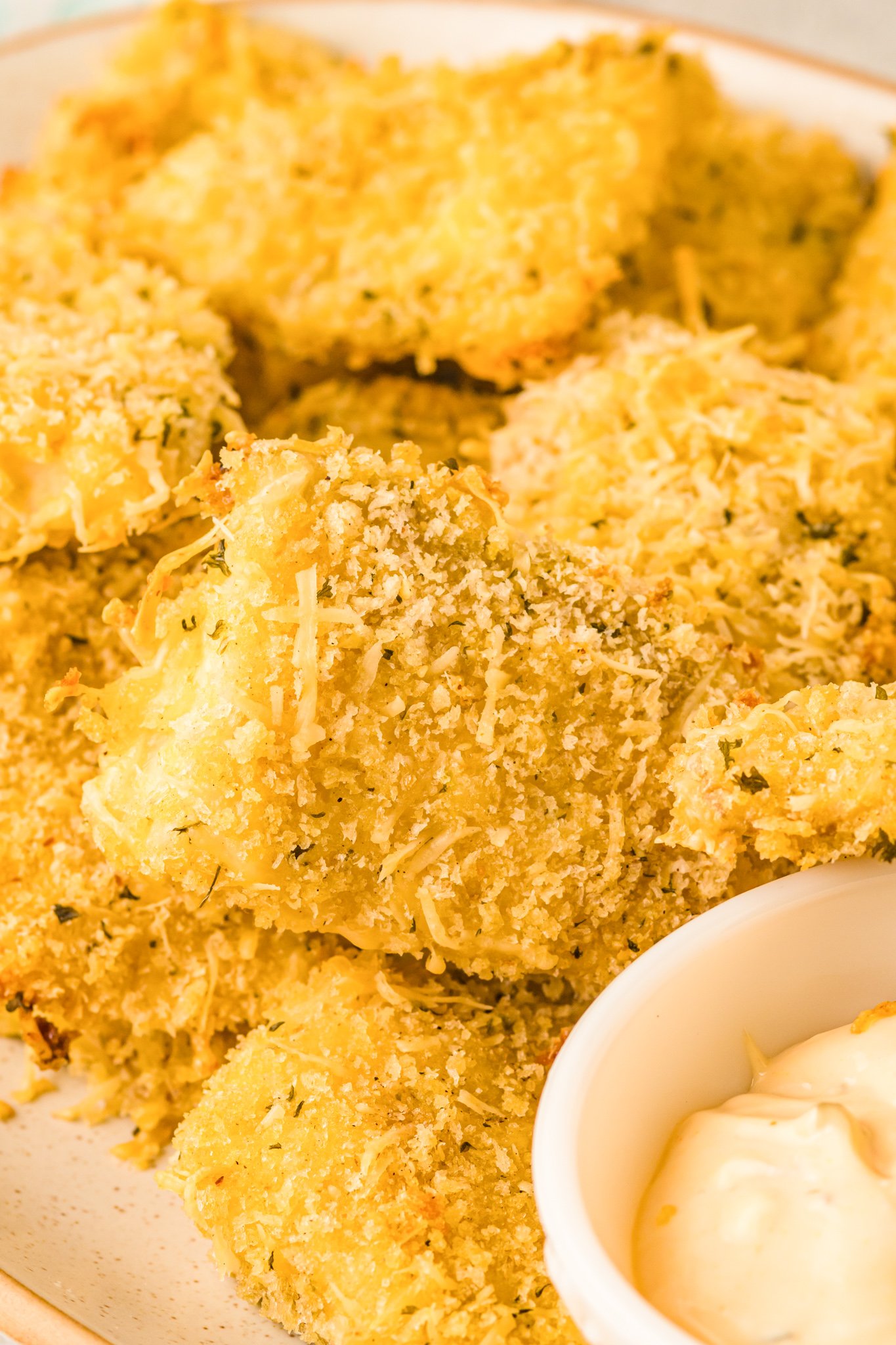 Baked Parmesan Fish Sticks on a white plate.