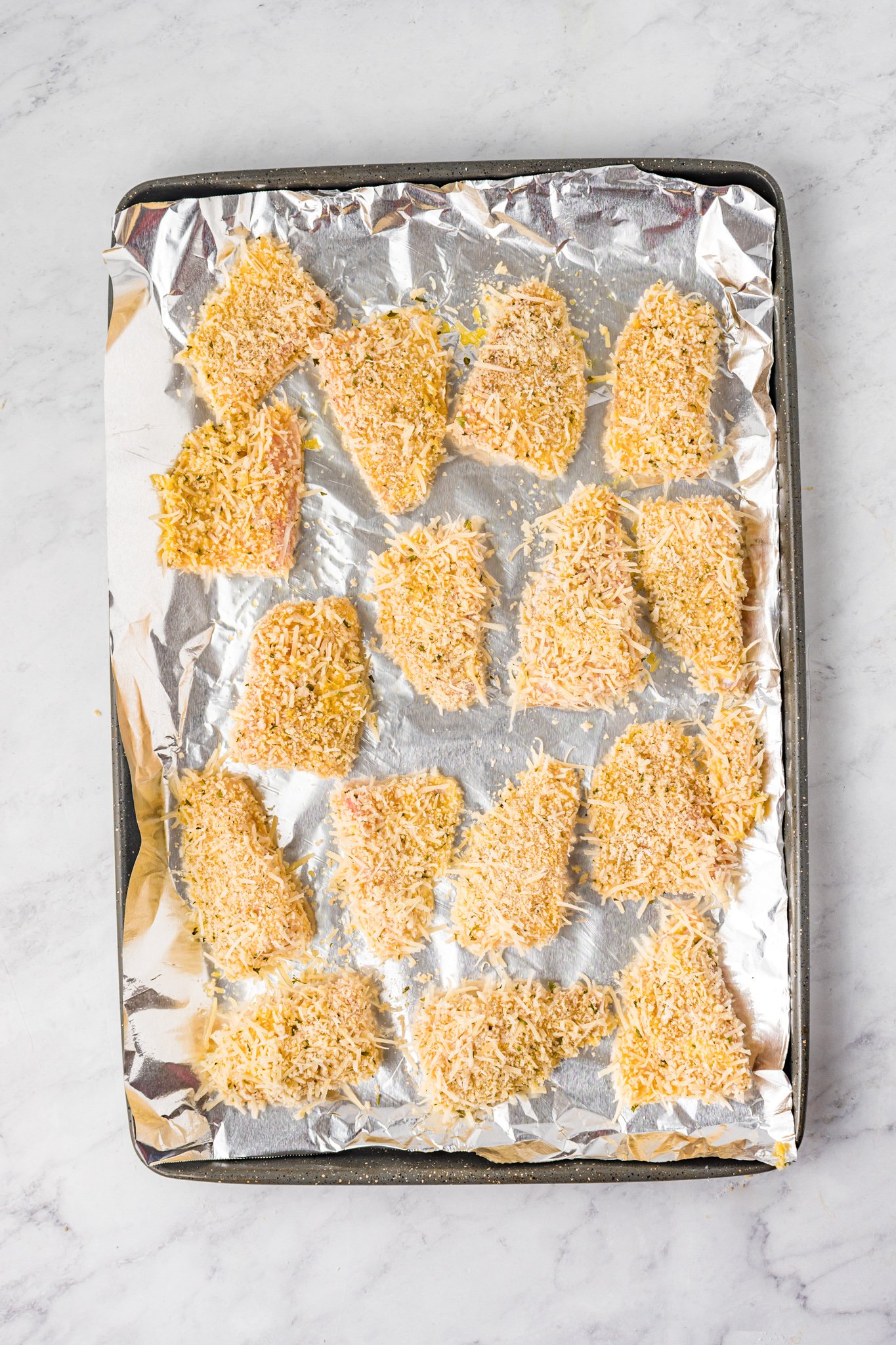 Baked Parmesan Fish Sticks on a baking sheet. 