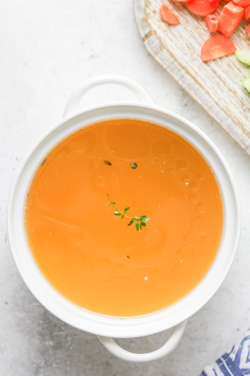  Homemade Chicken Broth in a white bowl. 