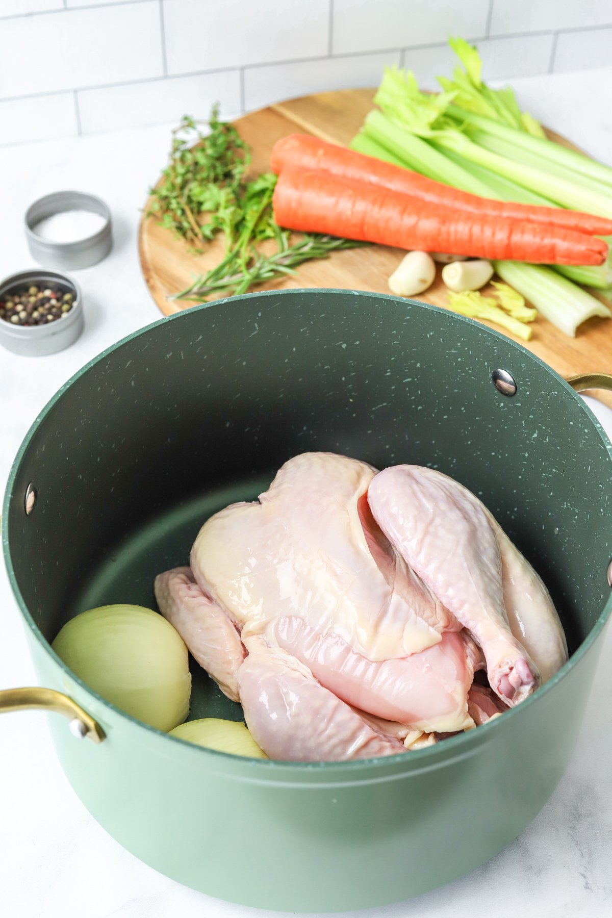 Homemade Chicken Broth chicken in a pot.