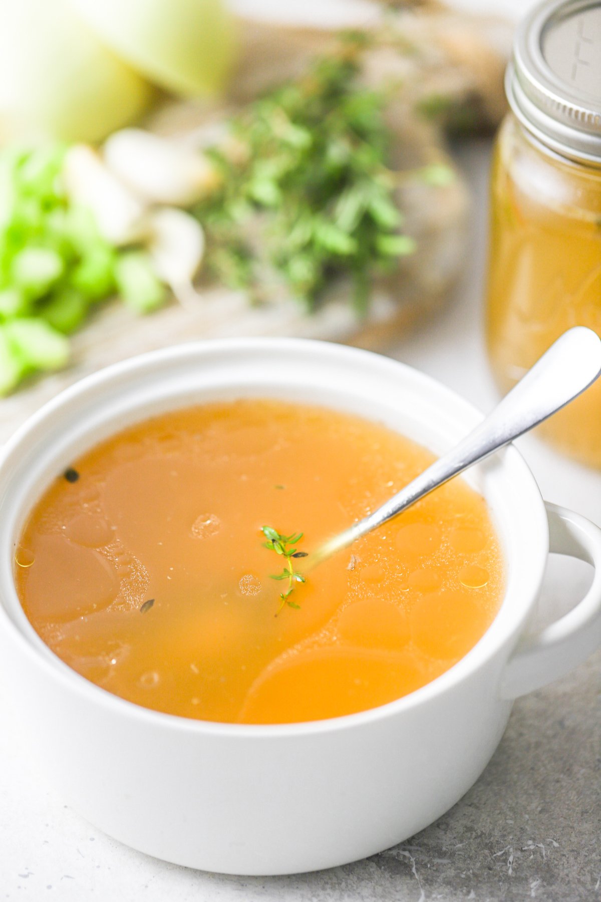  Homemade Chicken Broth in a white bowl.