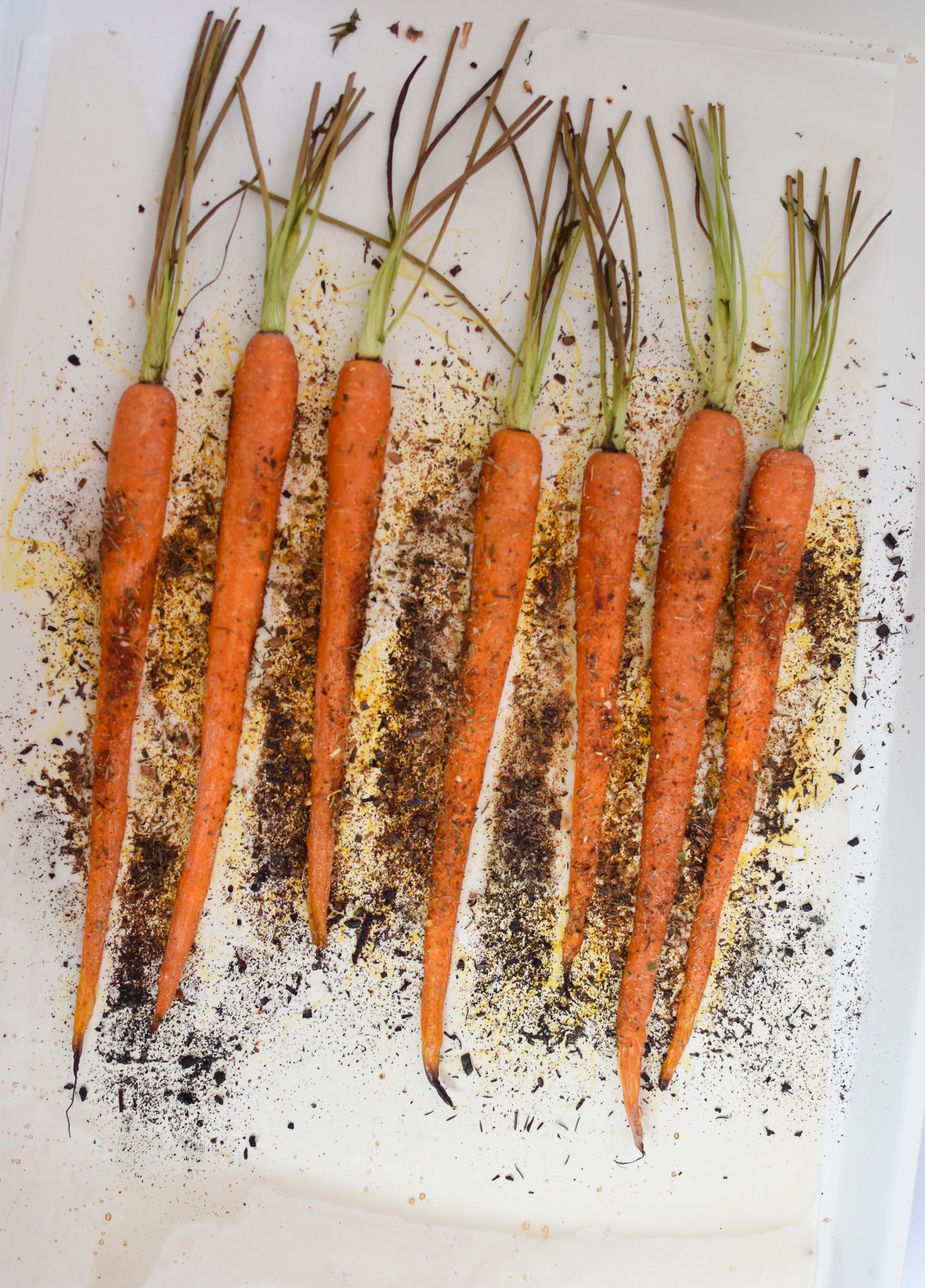 Roasted Carrots with Pistachios roasted carrots on a baking sheet. 
