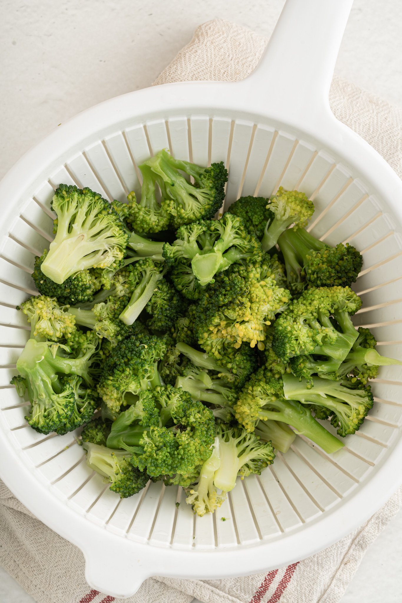 Creamy Broccoli Pasta Recipe broccoli in a strainer.