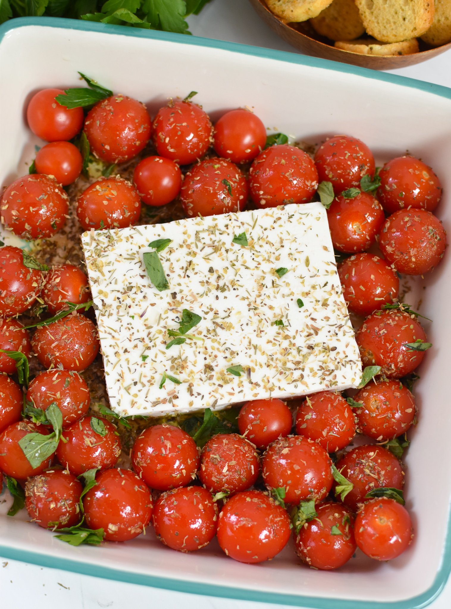 Easy Baked Feta Recipe feta in a baking dish. 