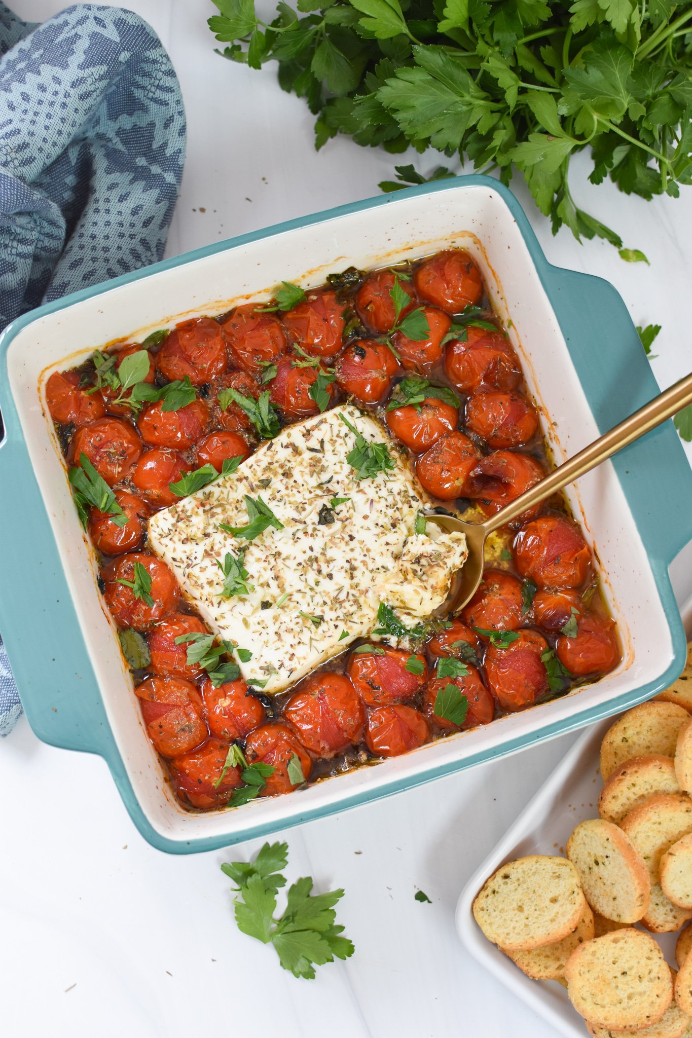 Easy Baked Feta Recipe in a blue baking dish. 