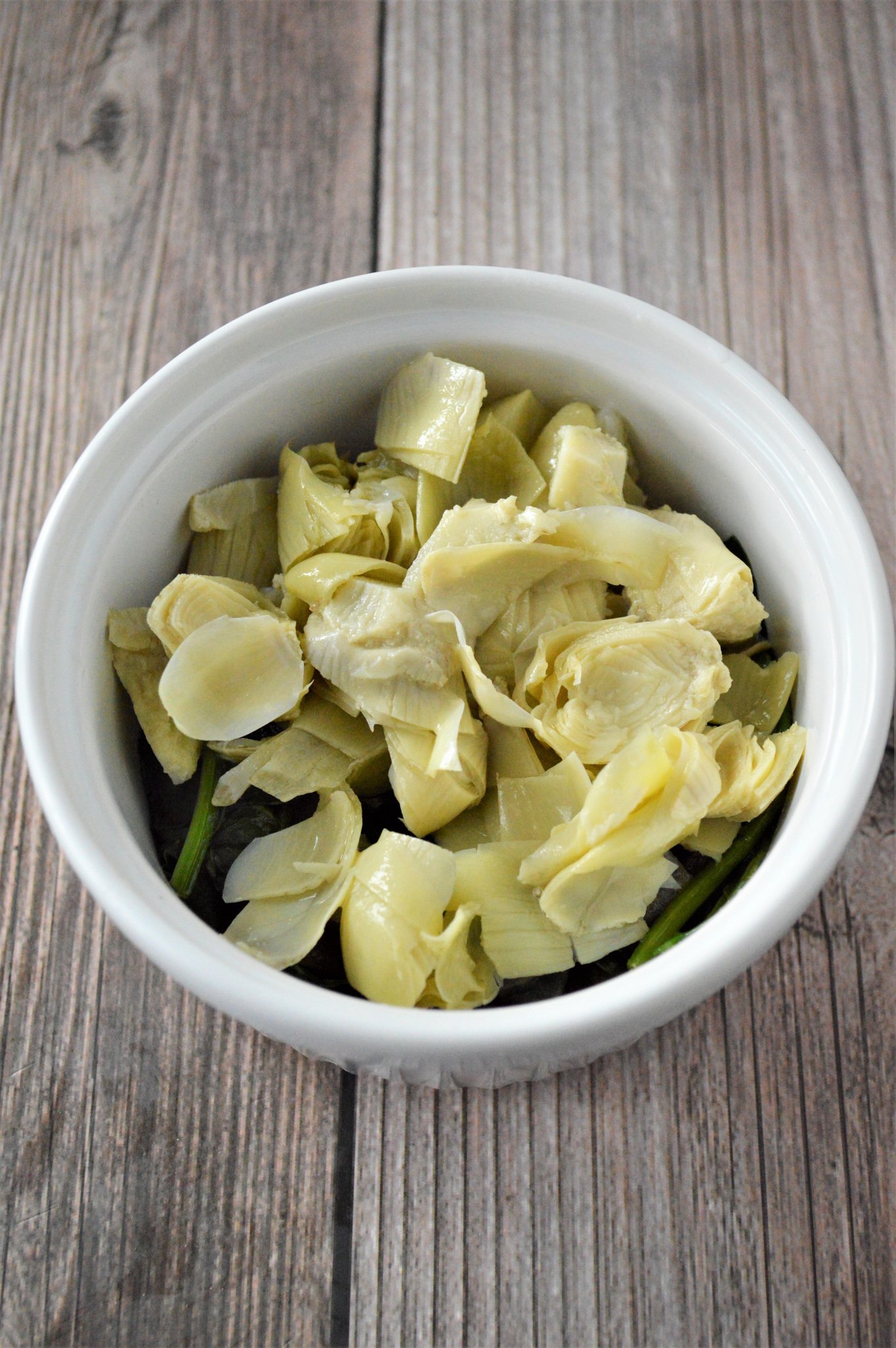 Greek Baked Eggs artichokes in a dish.