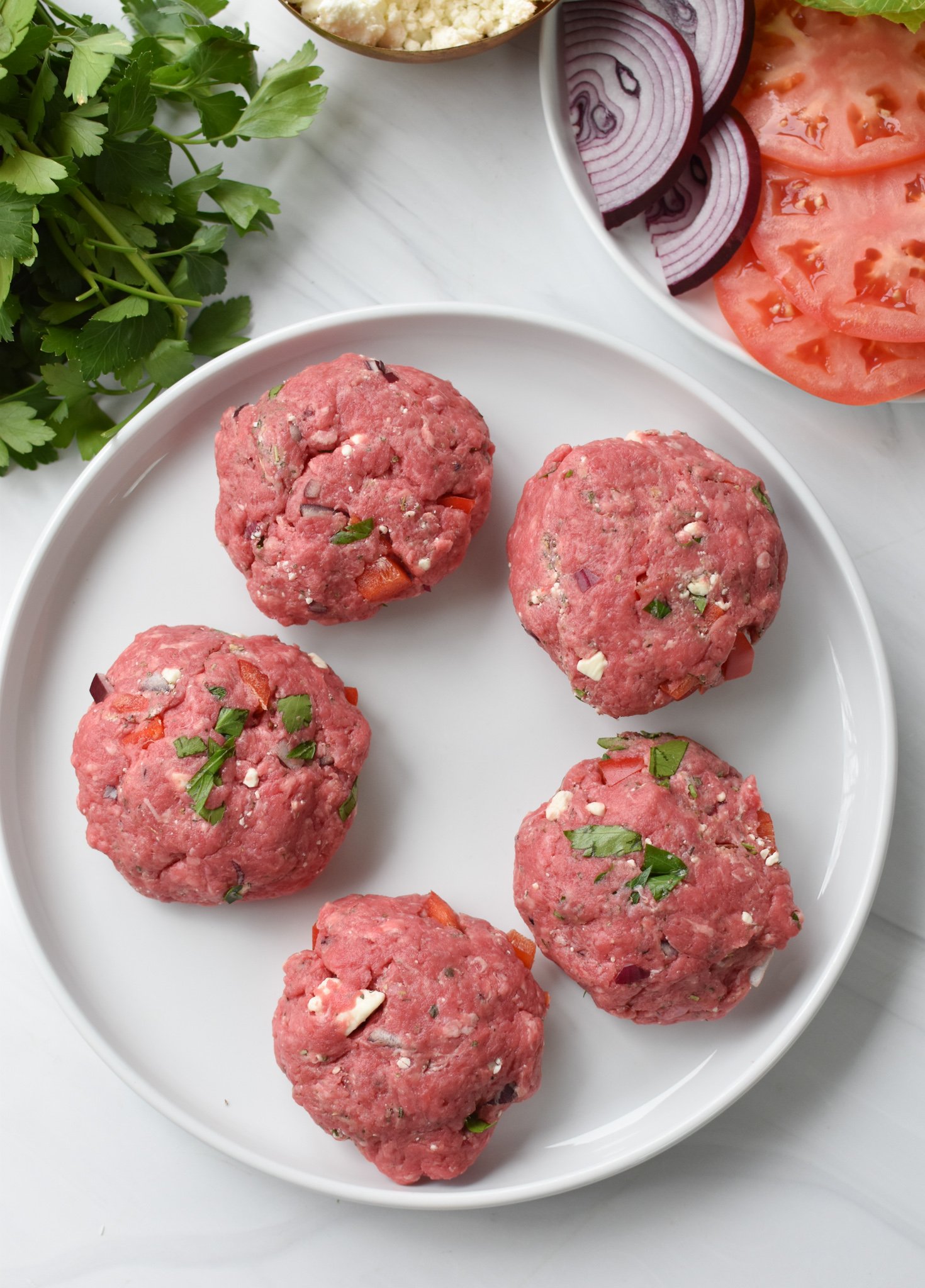 Feta Burger with Tzatziki burgers on a plate. 