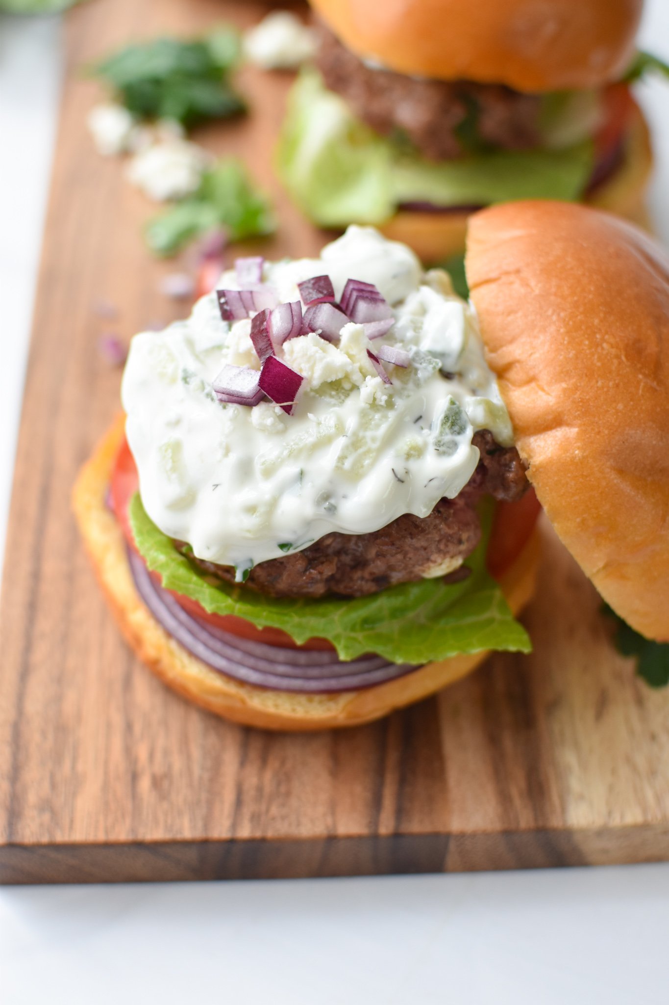 Feta Burger with Tzatziki with red onion.