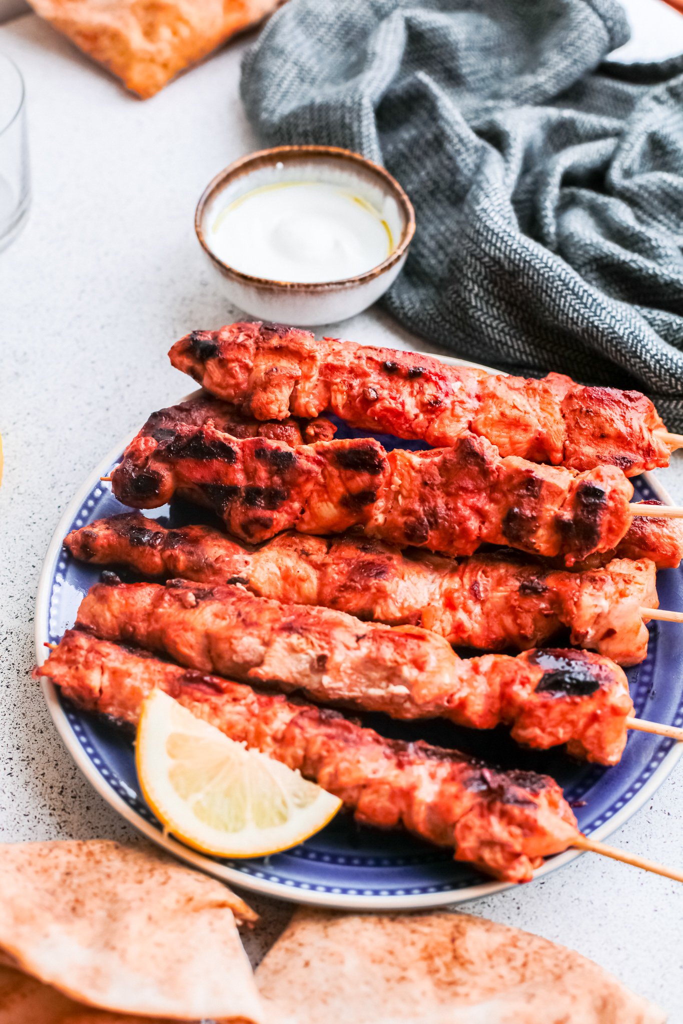 Lebanese Chicken Kebabs on a blue platter.