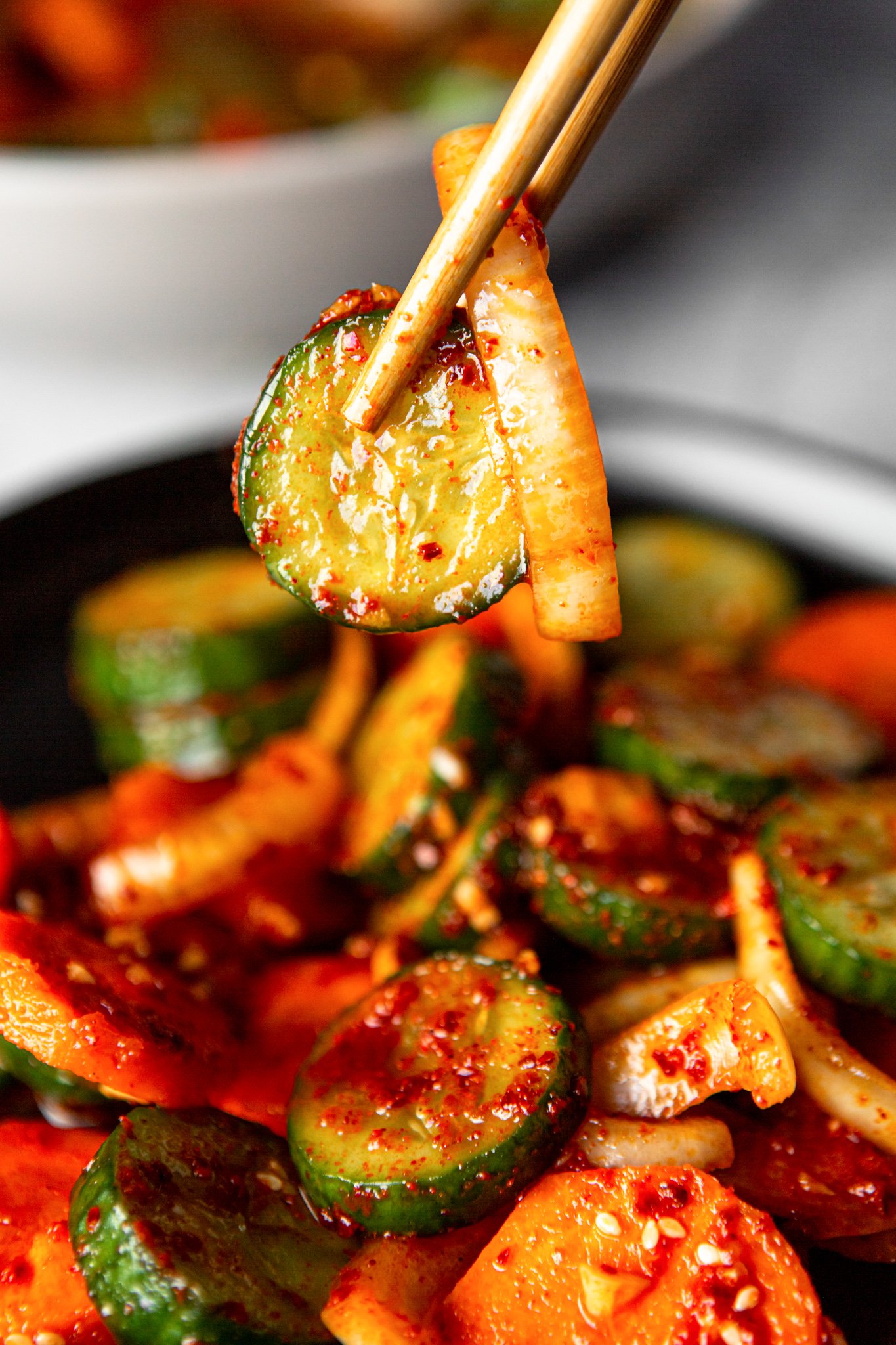 Quick Korean Cucumber Kimchi with chopsticks.
