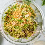 Broccoli Slaw Recipe in clear glass bowl.