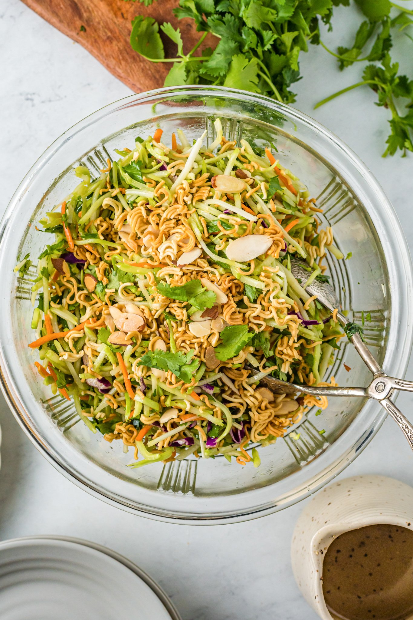 Broccoli Slaw Recipe in clear glass bowl.