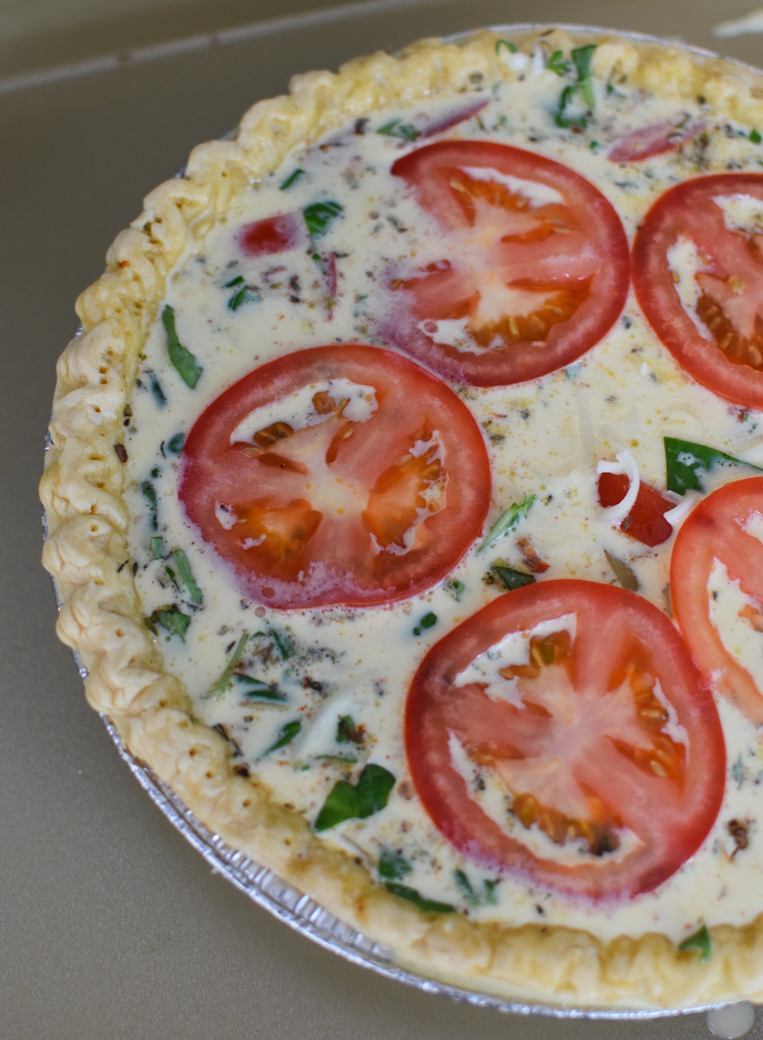 Caprese Quiche Lorraine Recipe tomatoes on top of quiche.