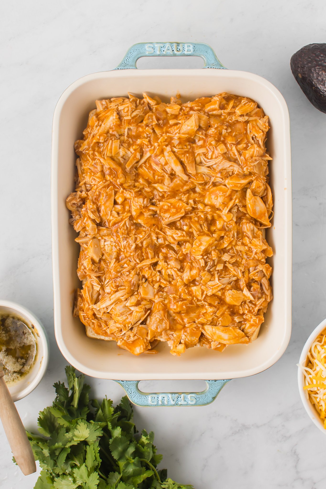 Chicken Enchilada Sliders topped with chicken.
