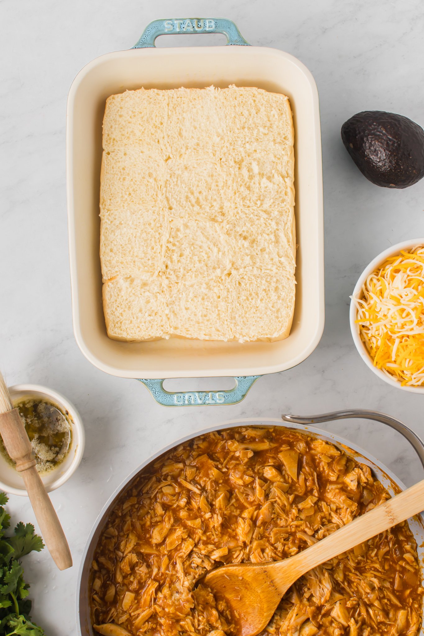 Chicken Enchilada Sliders buns in a pan 