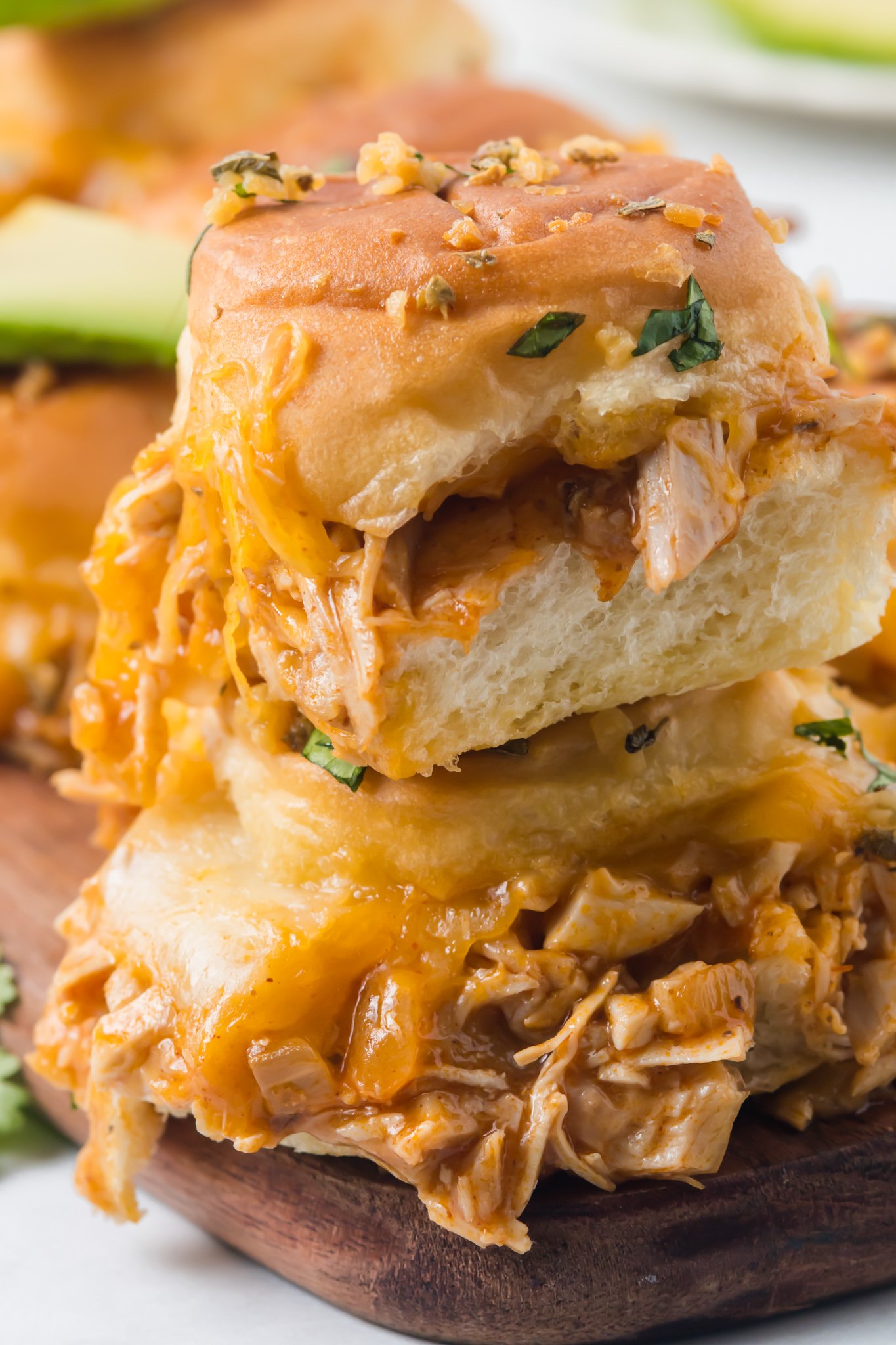 Chicken Enchilada Sliders with cheese.