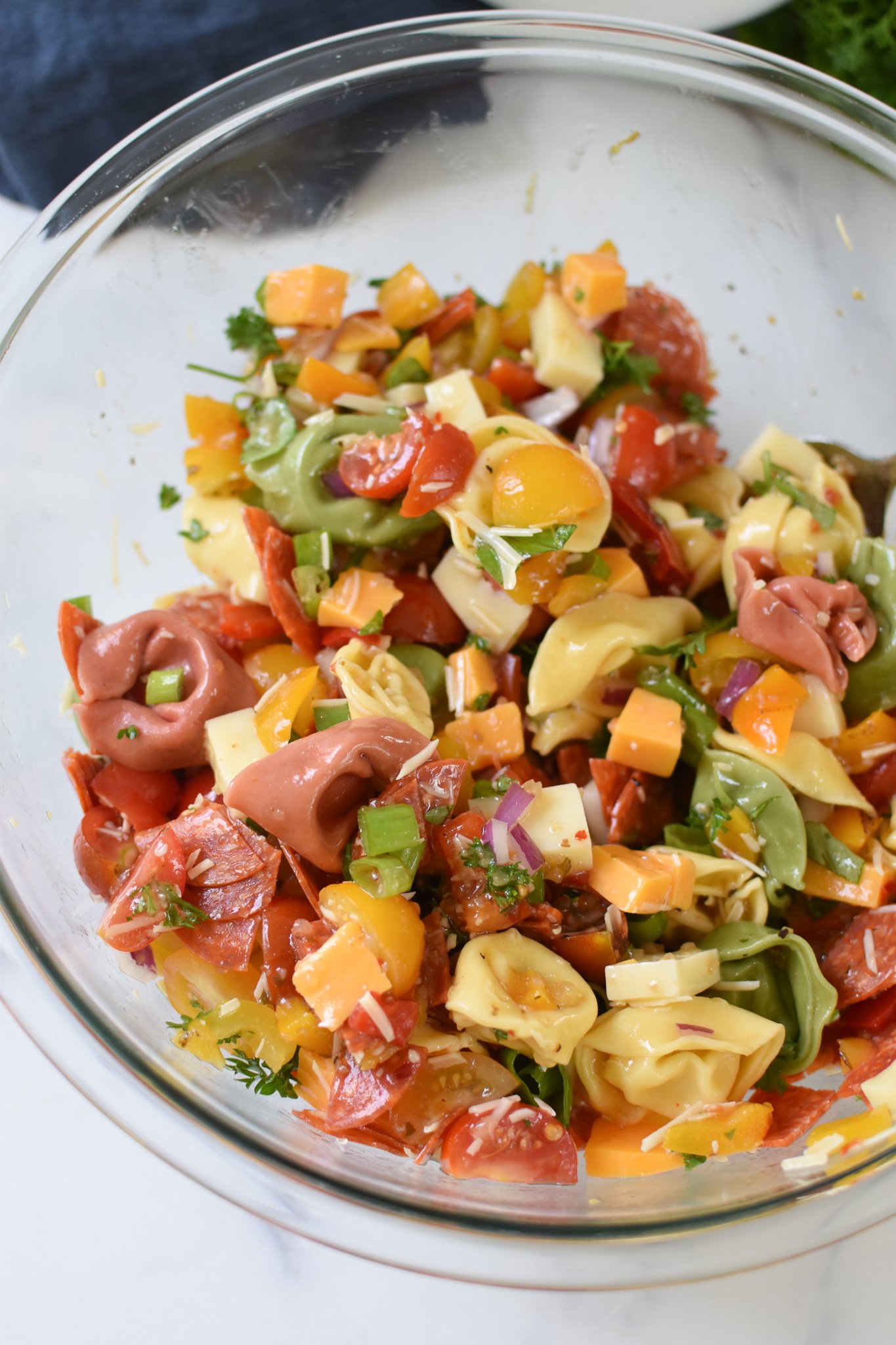 Italian Tortellini Salad in a clear bowl.
