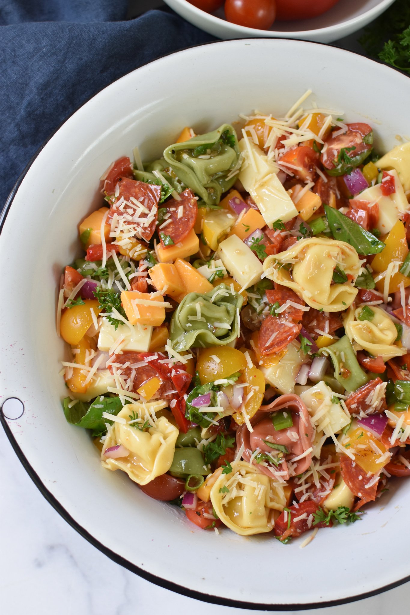Italian Tortellini Salad in a white bowl. 