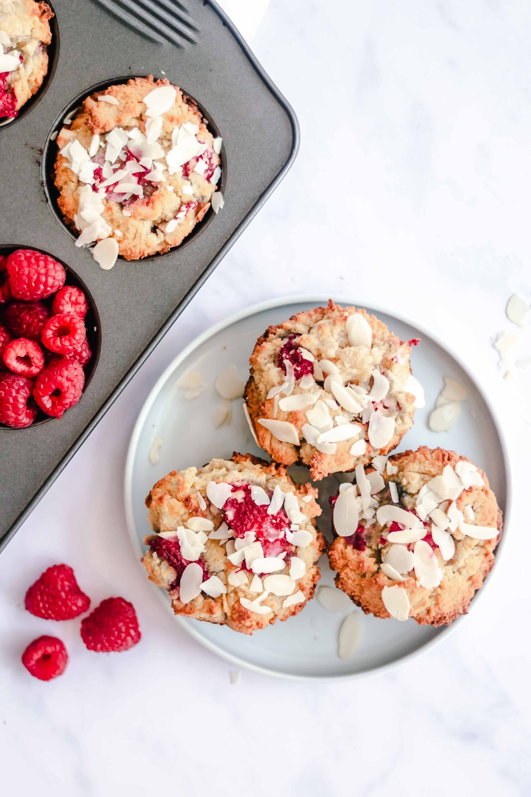 Keto Raspberry Muffins on a white plate. 