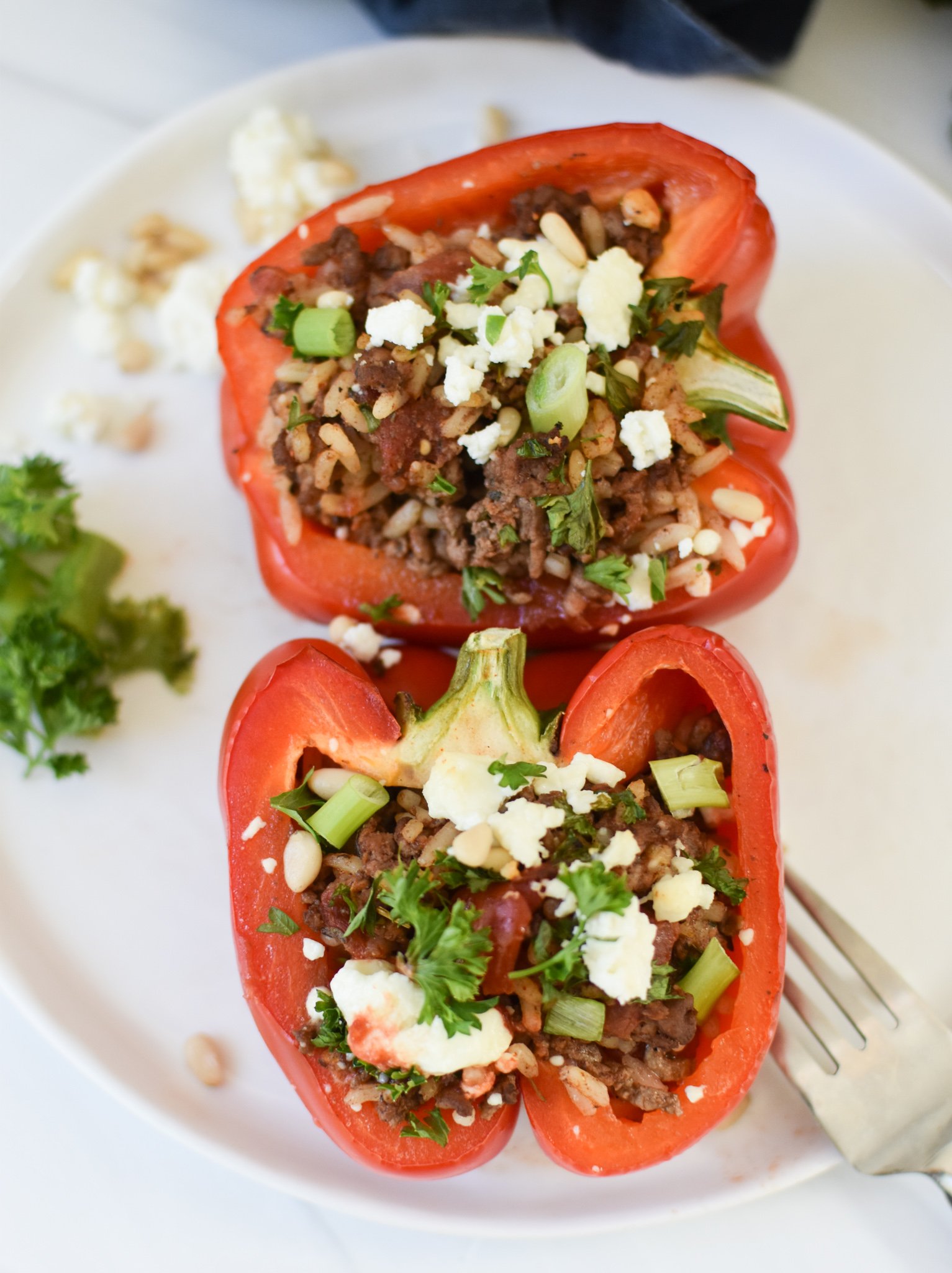 Mediterranean Ground Beef Stuffed Peppers on a white plate.