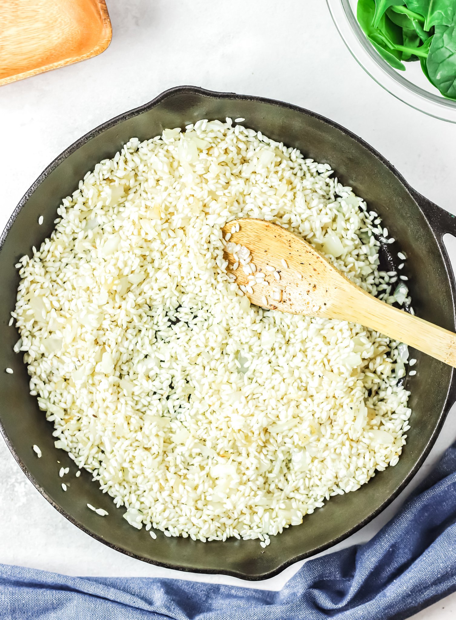 Oven Baked Chicken Thighs with Risotto risotto in a skillet. 