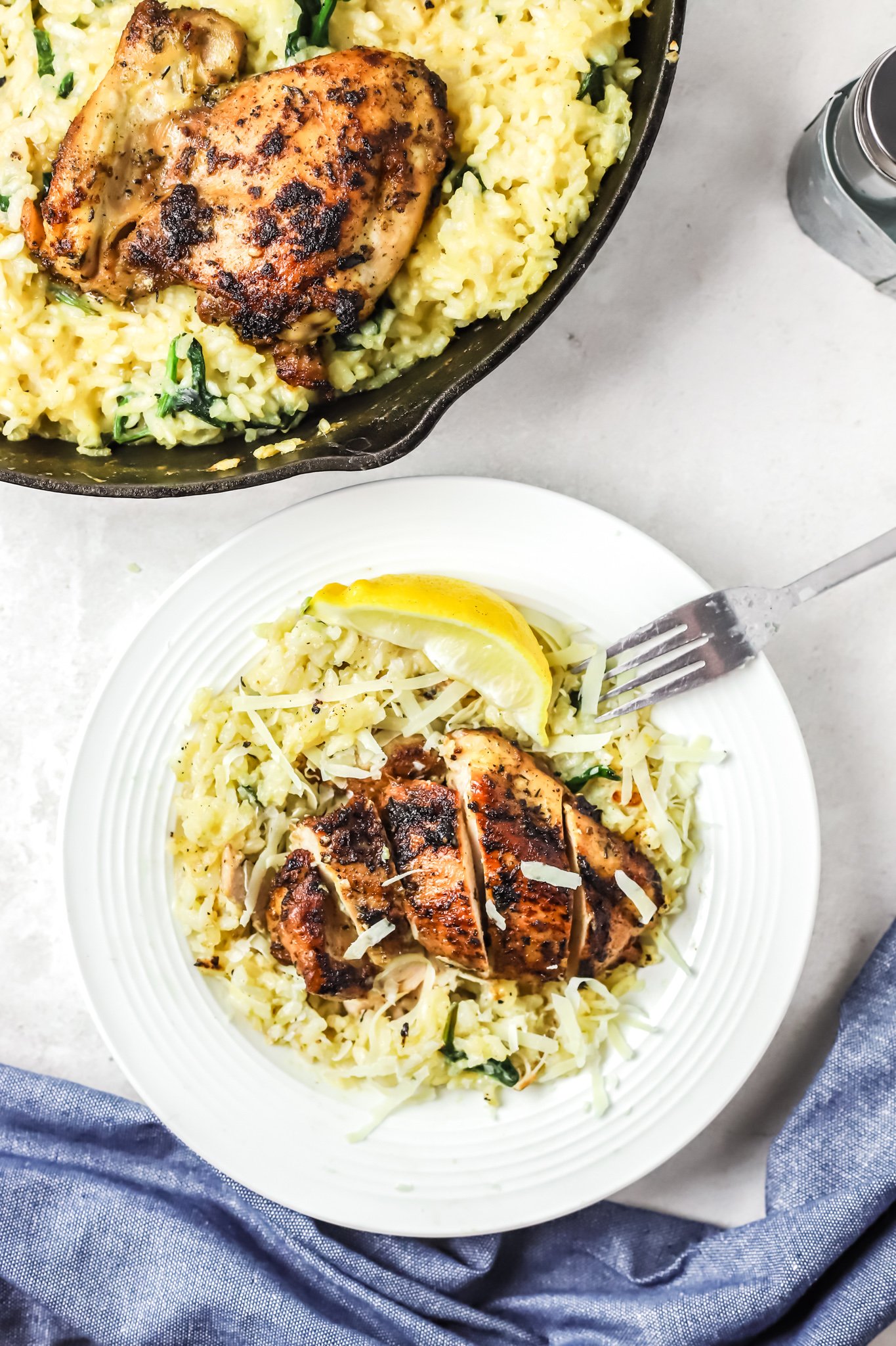 Oven Baked Chicken Thighs with Risotto with fork. 