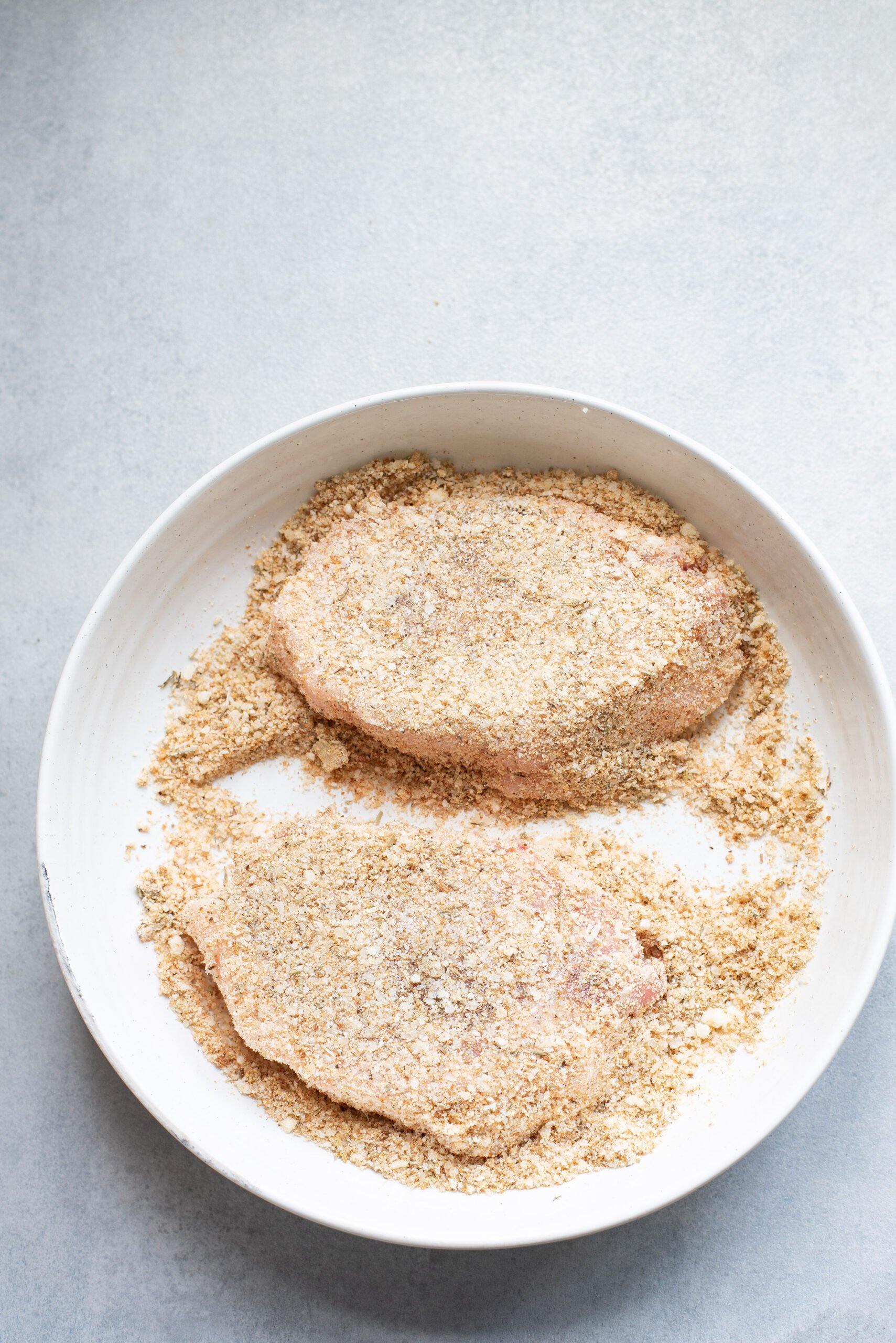 Parmesan Crusted Pork Chops pork chop in breadcrumbs.