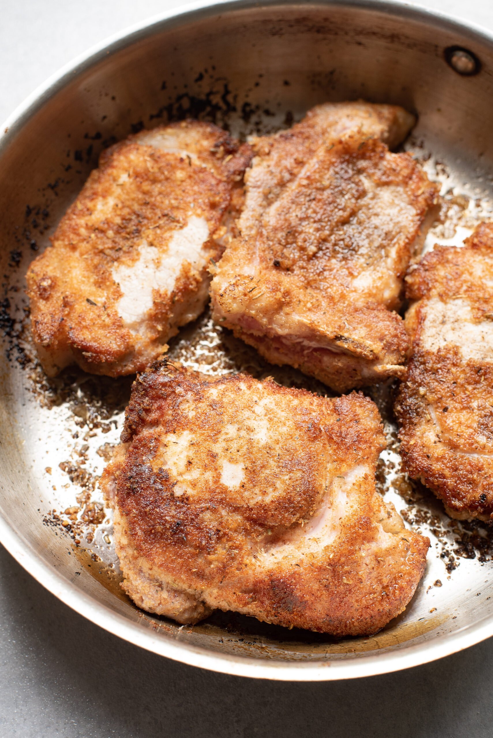 Parmesan Crusted Pork Chops searing pork chops.
