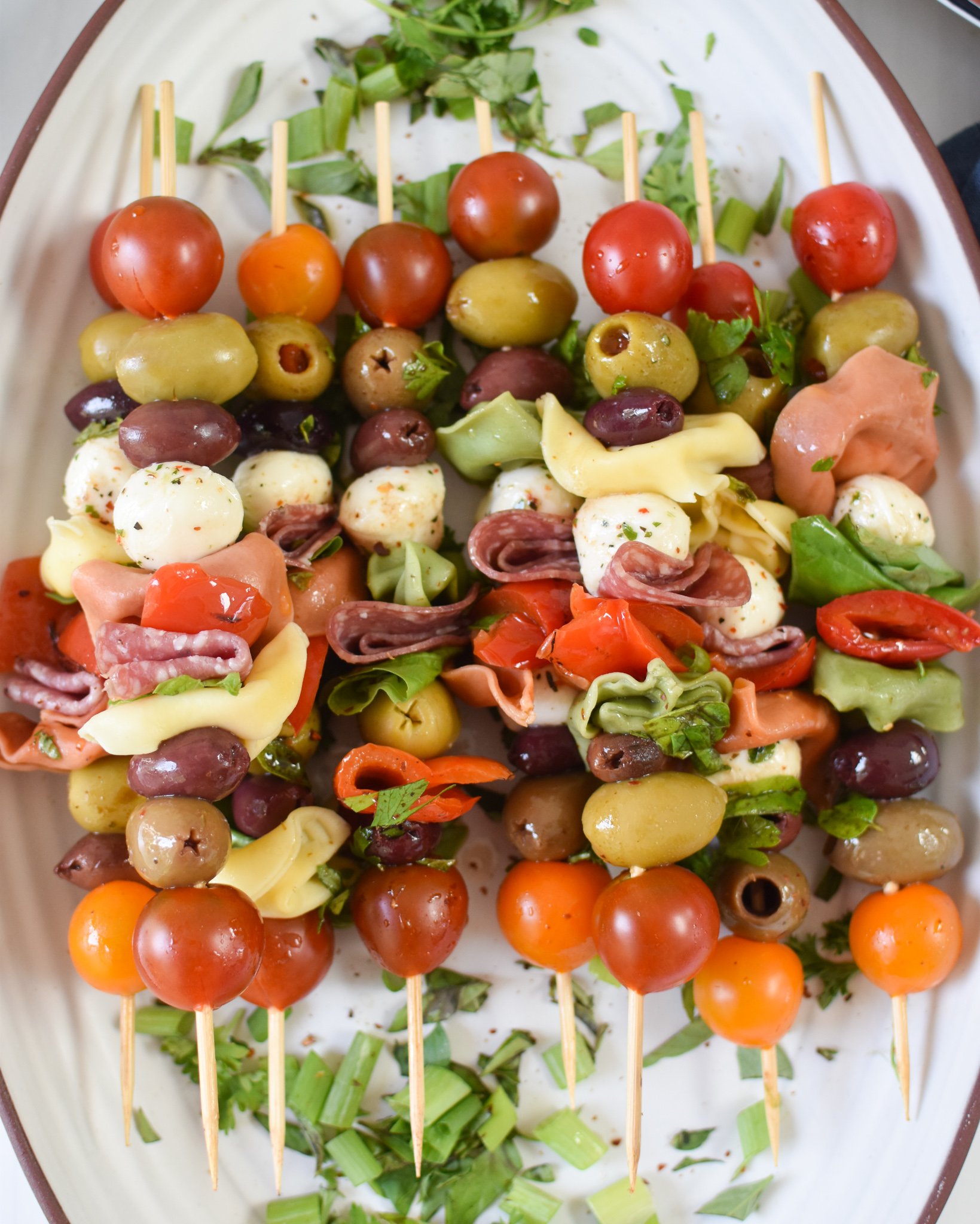 Antipasto Skewers on a white plate.
