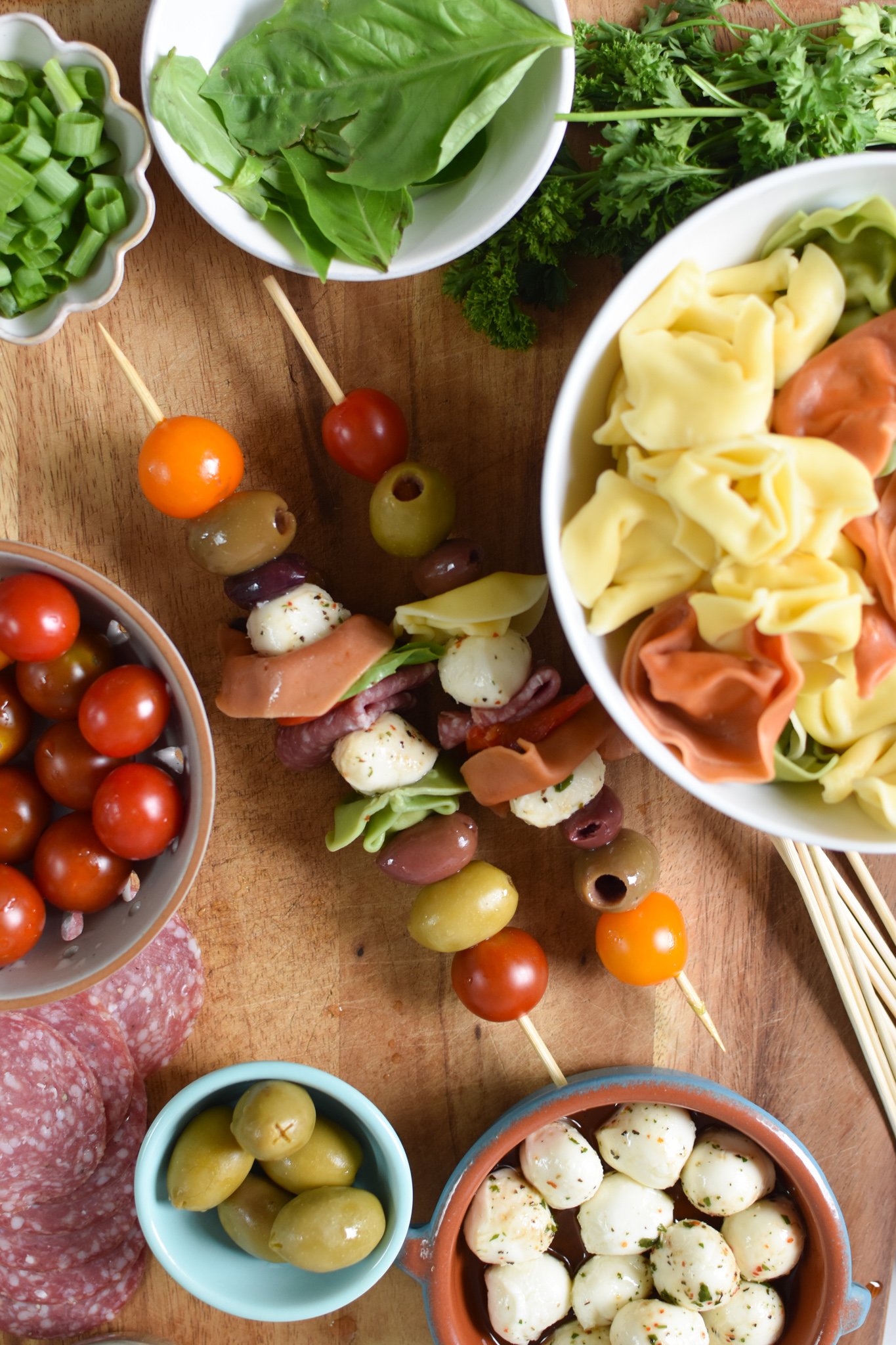 Antipasto Skewers skewers on a cutting board. 