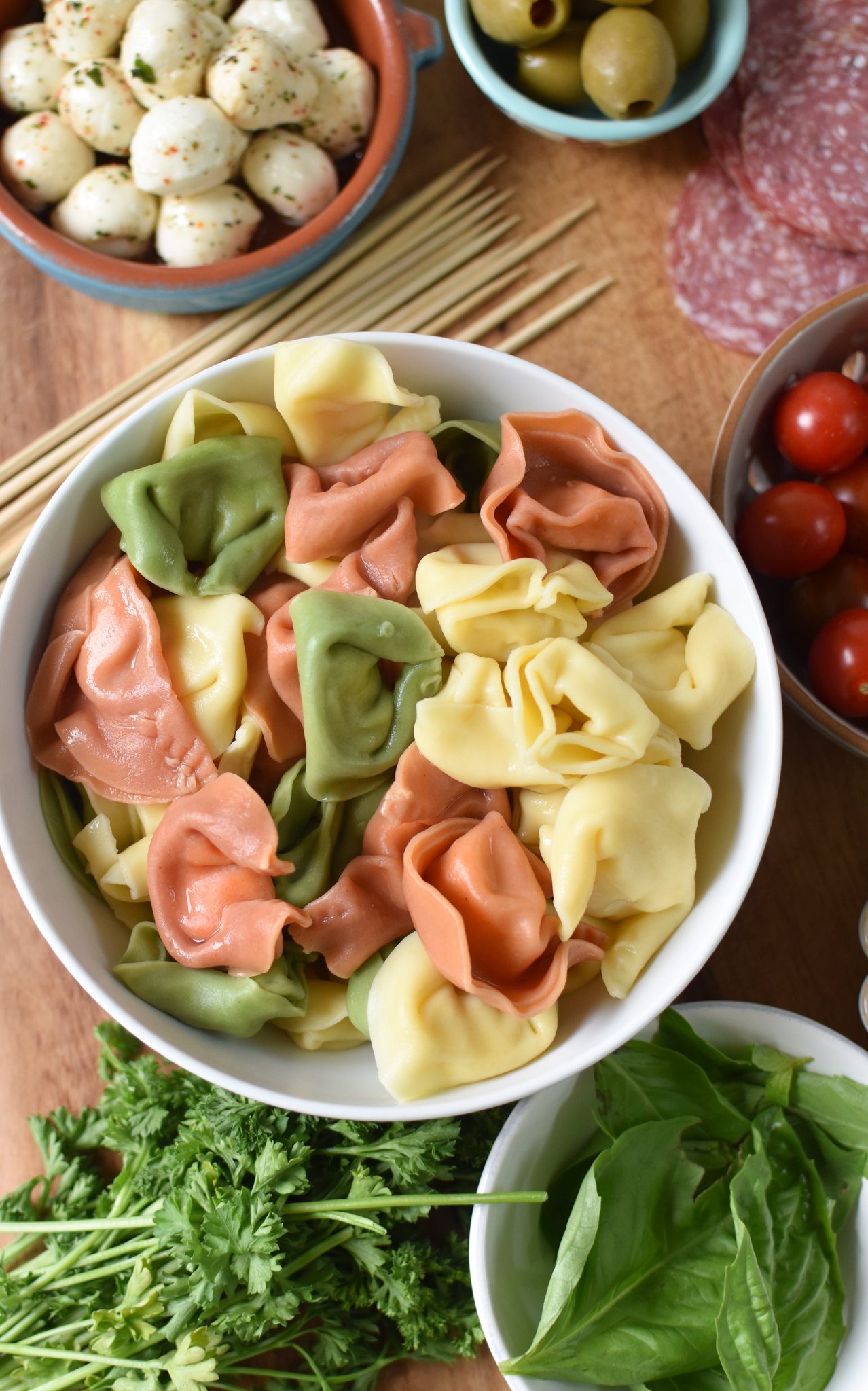 Antipasto Skewers tortellini on a cutting board. 