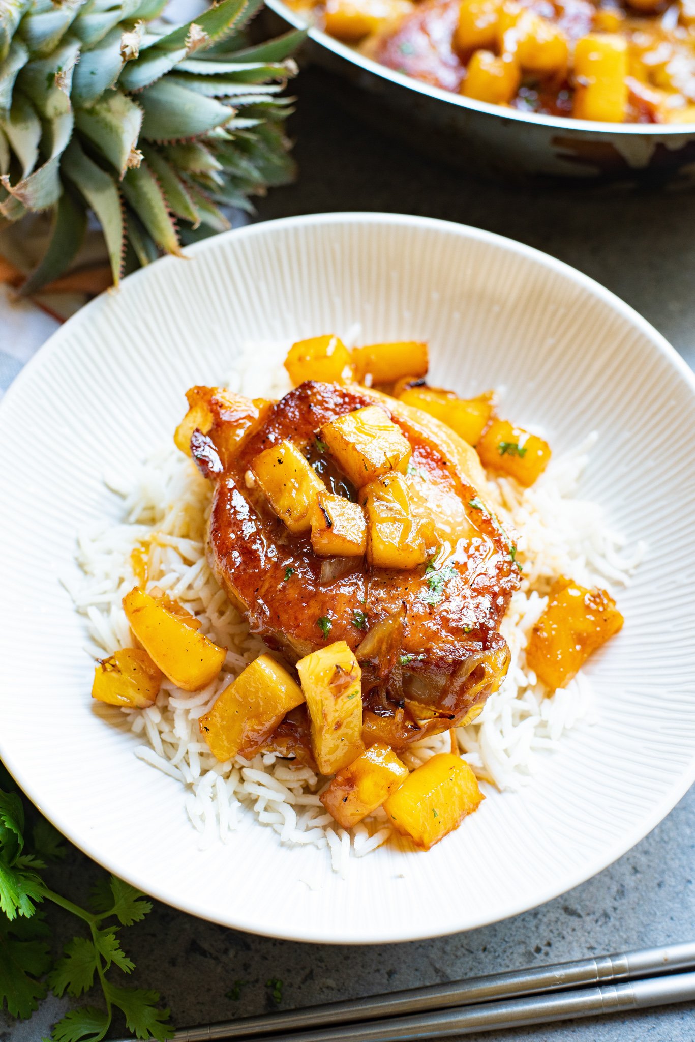 Easy pineapple pork chops on a white plate. 