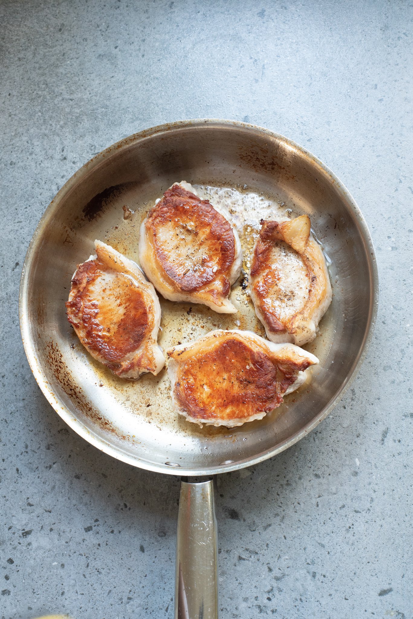 Easy pineapple pork chops seared in skillet. 