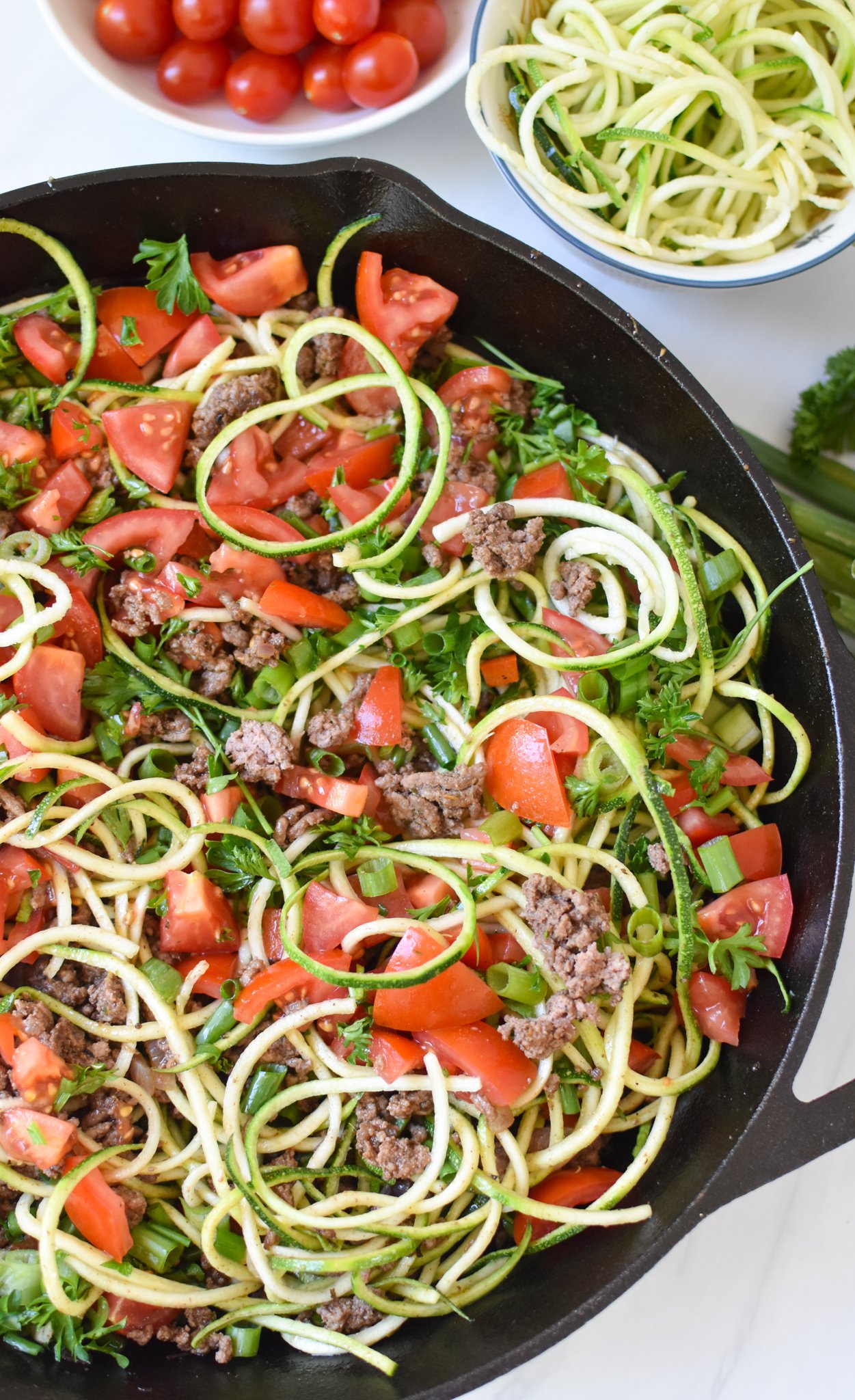 Mediterranean Ground Beef Zucchini Skillet in a cast iron skillet. 