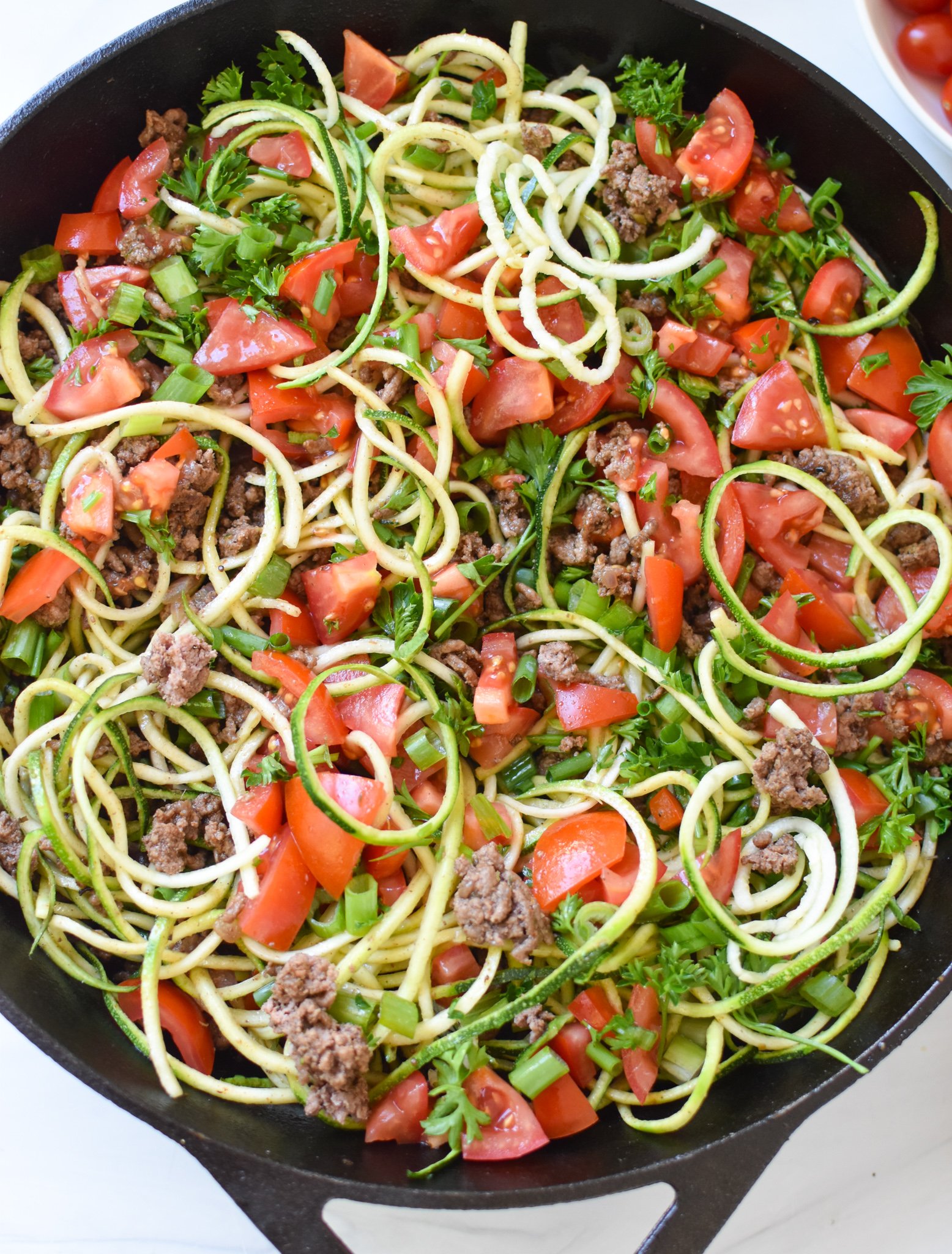 Mediterranean Ground Beef Zucchini SkilleT with parsley.