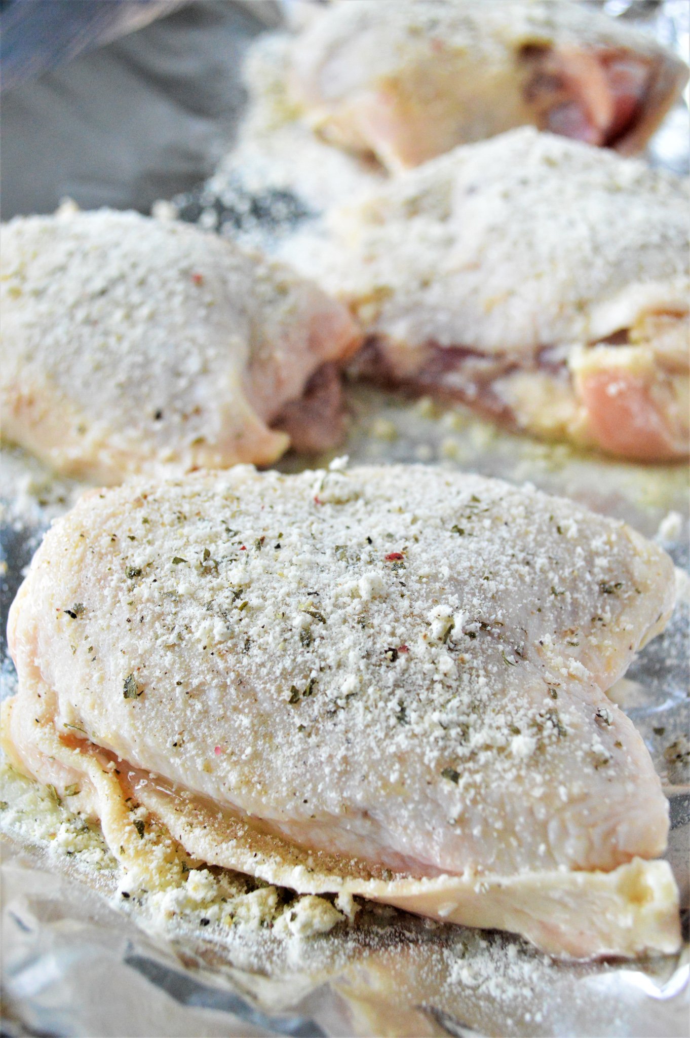Oven Baked Ranch Chicken Thighs chicken with seasoning. 