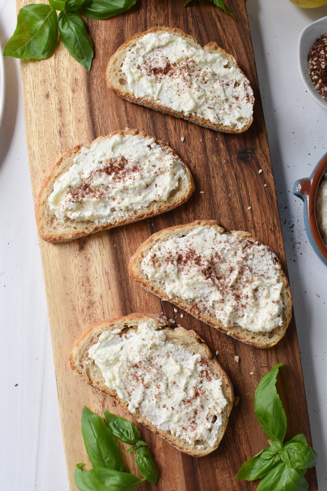 Tomato Toast with Whipped Feta whipped feta on bread. 