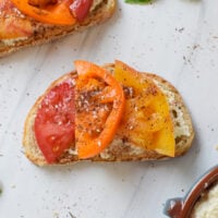 Tomato Toast with Whipped Feta with fresh basil.