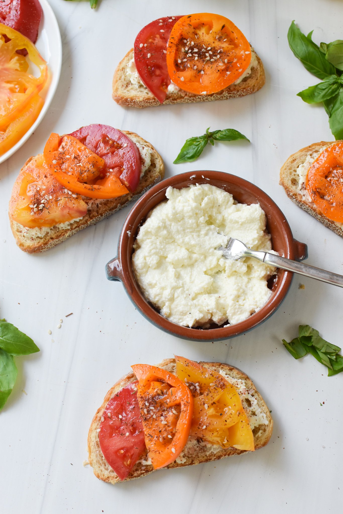 Tomato Toast with Whipped Feta with feta in the middle. 