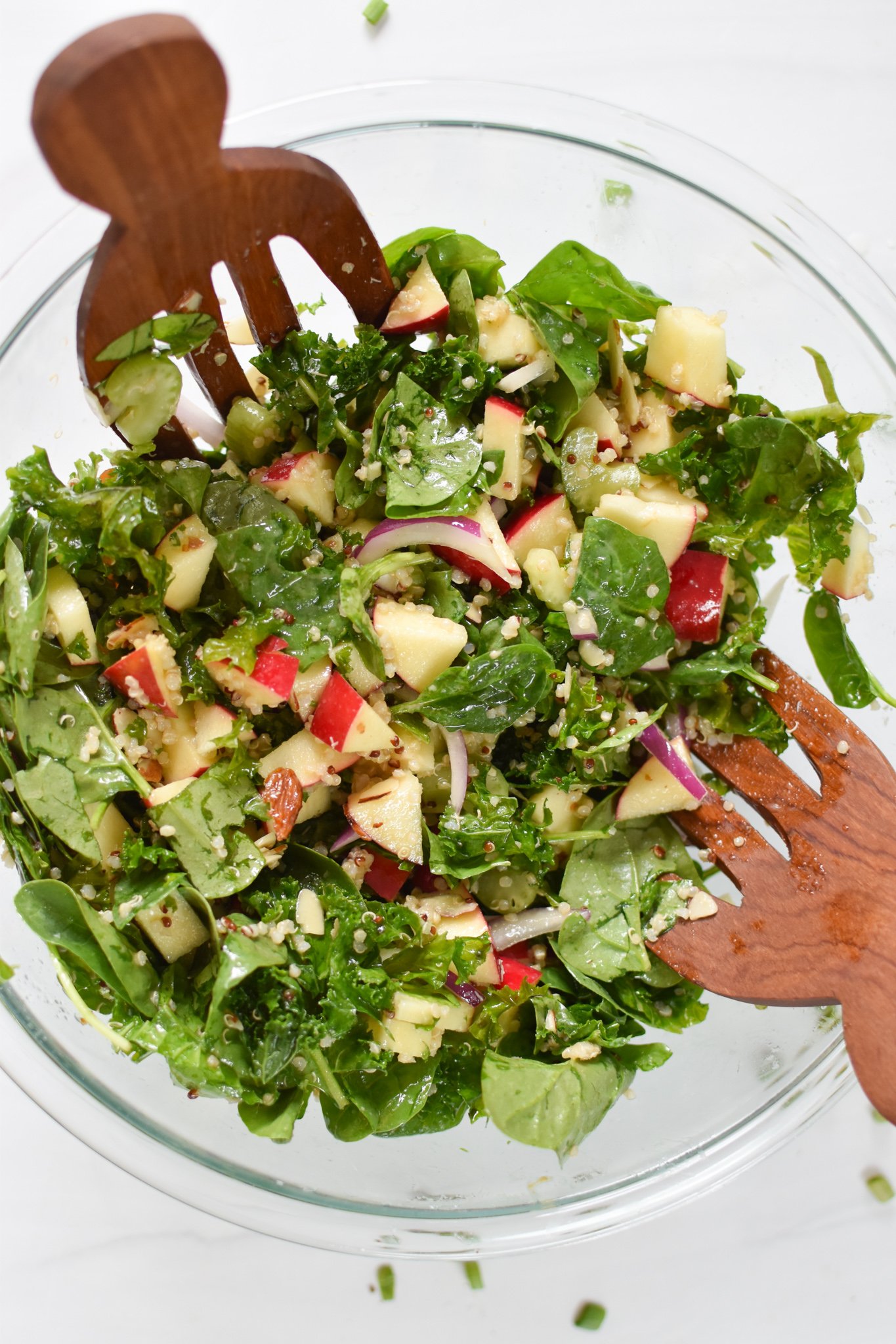 Apple Kale Quinoa Salad ingredients in a bowl.