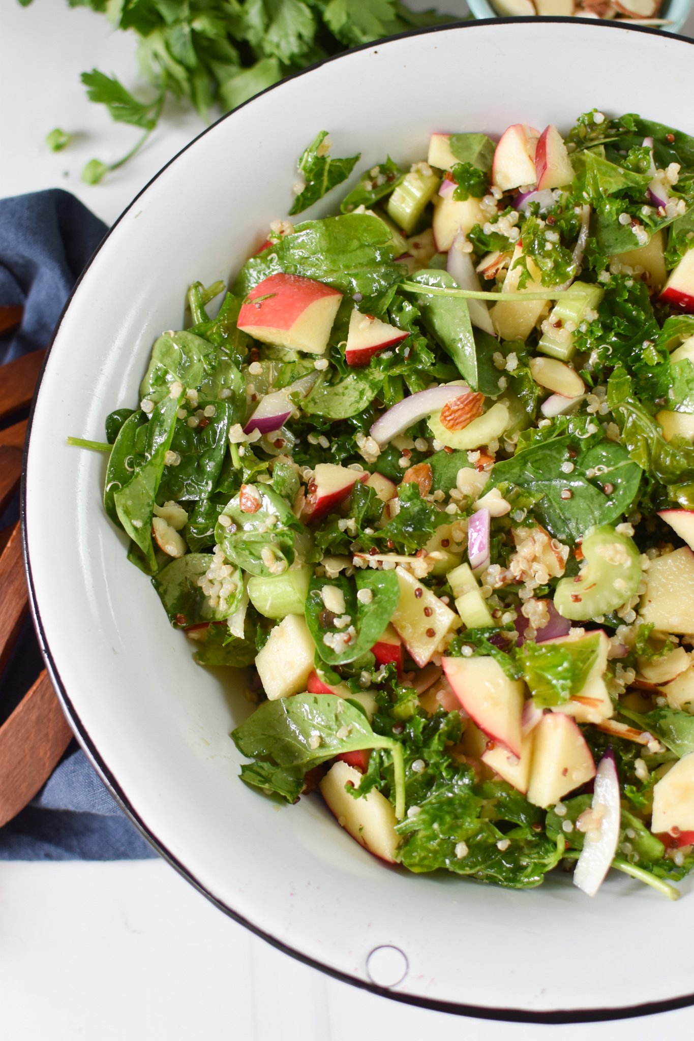 Apple Kale Quinoa Salad in a white bowl.