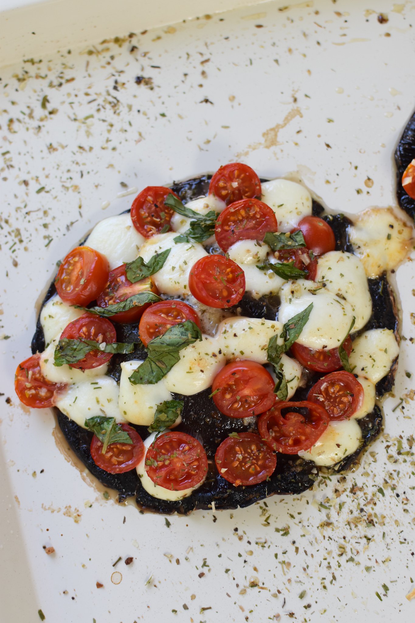 Caprese Stuffed Portobello Mushrooms on a baking sheet.
