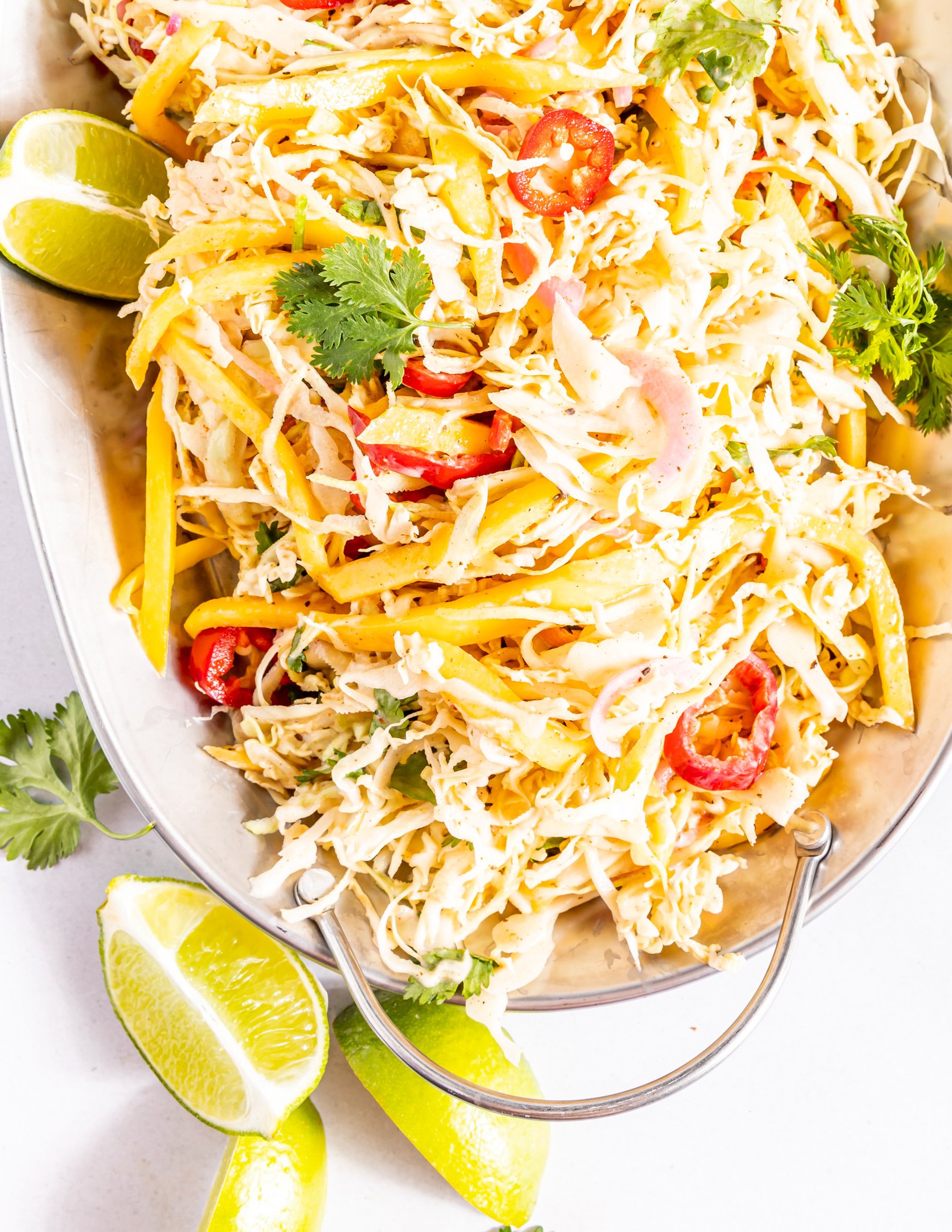 Easy Caribbean Coleslaw Recipe on a white platter.