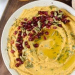 Creamy Pumpkin Hummus with pomegranate seeds.