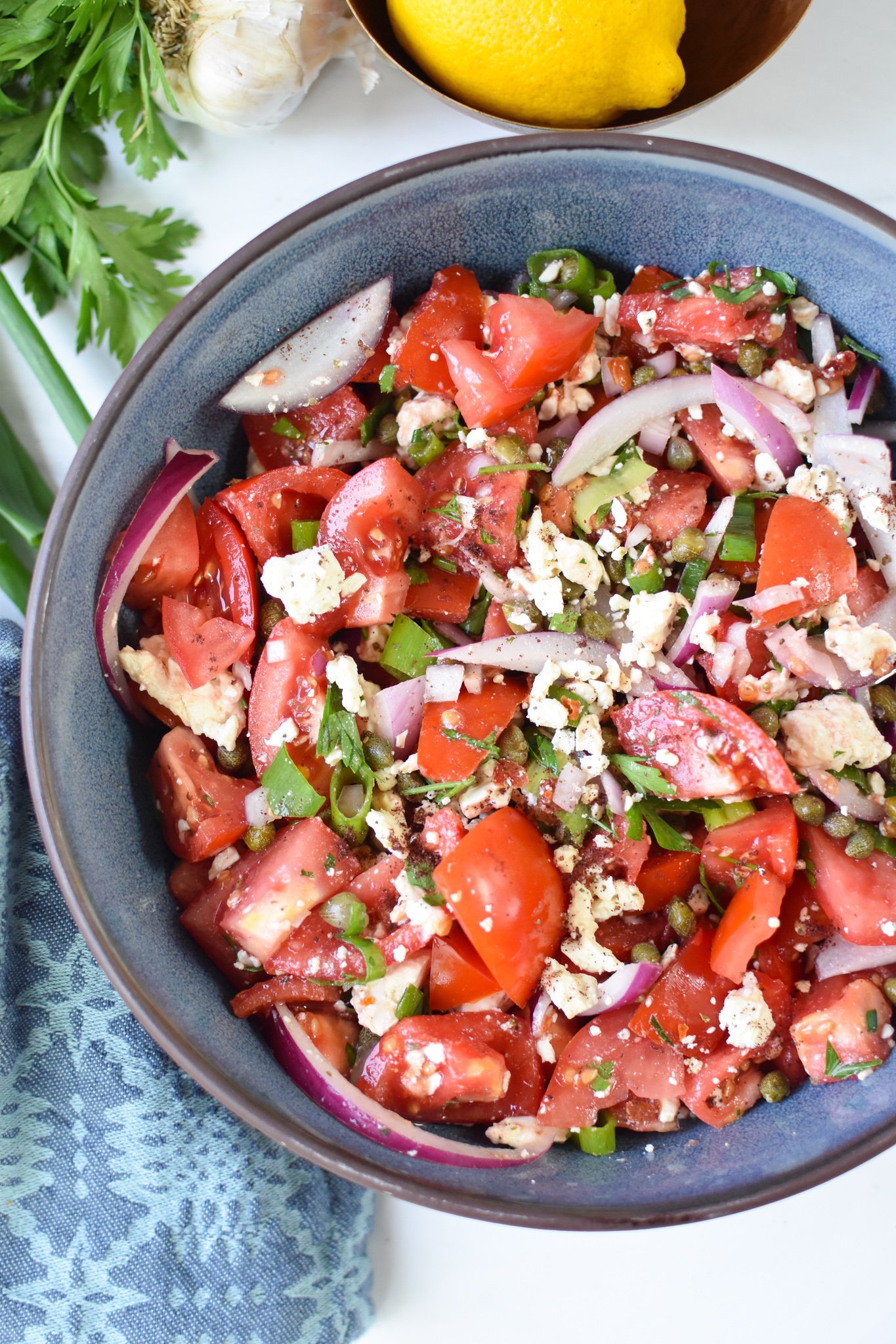 Easy Tomato Salad in a blue bowl.