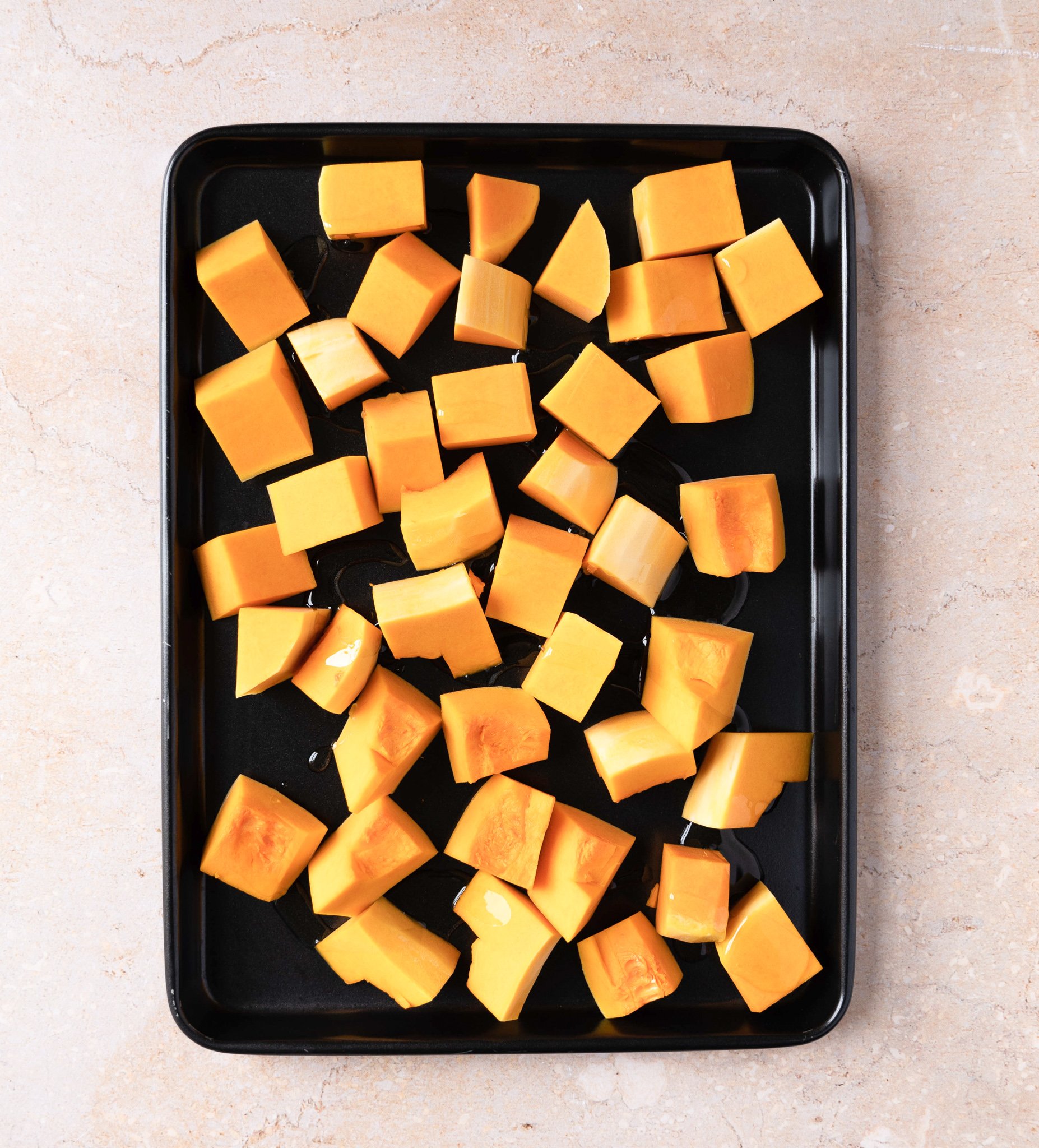 Thai Roasted Pumpkin Soup squash on a baking sheet. 