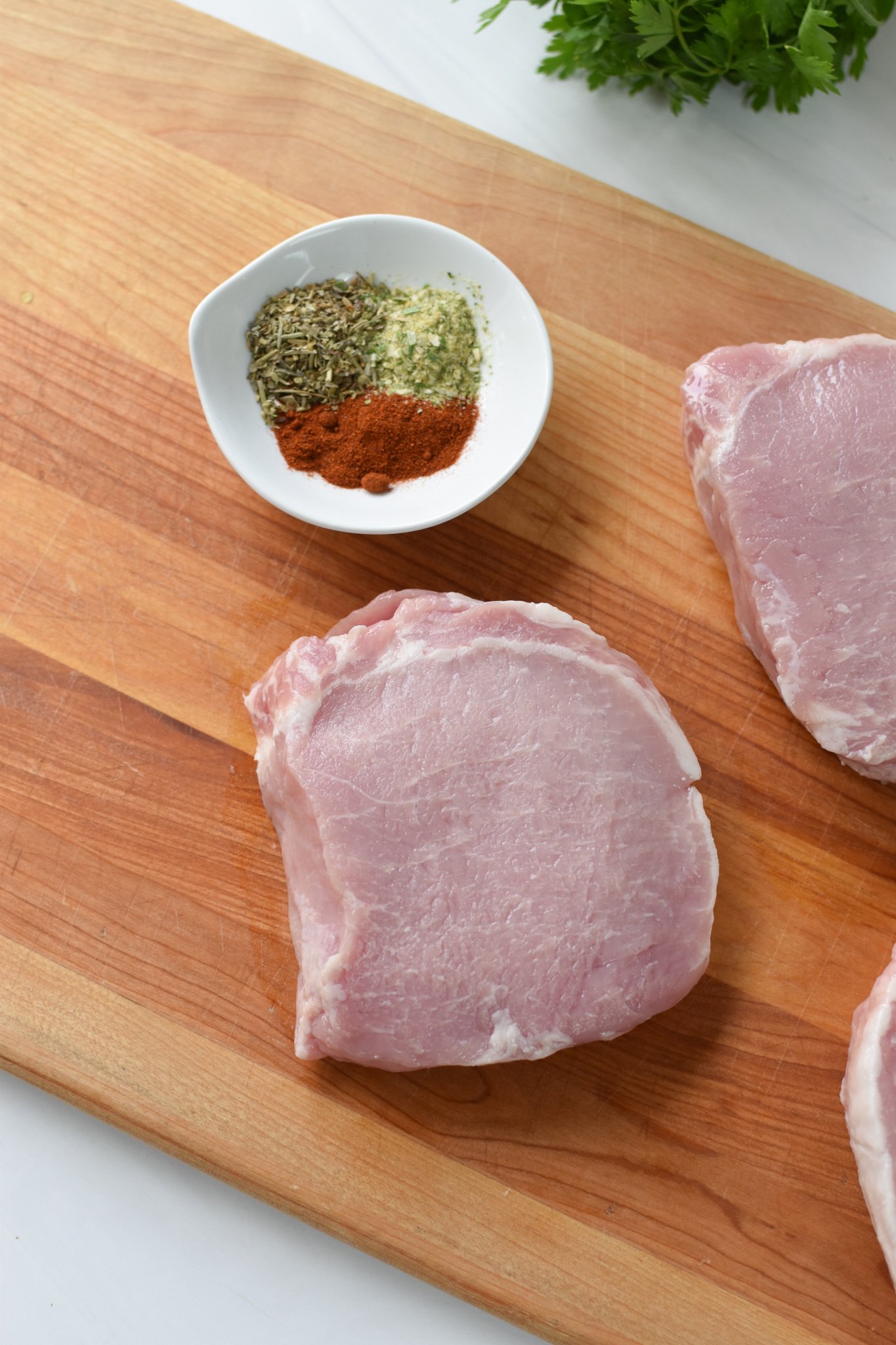 Air Fryer Boneless Pork Chops on a cutting board. 